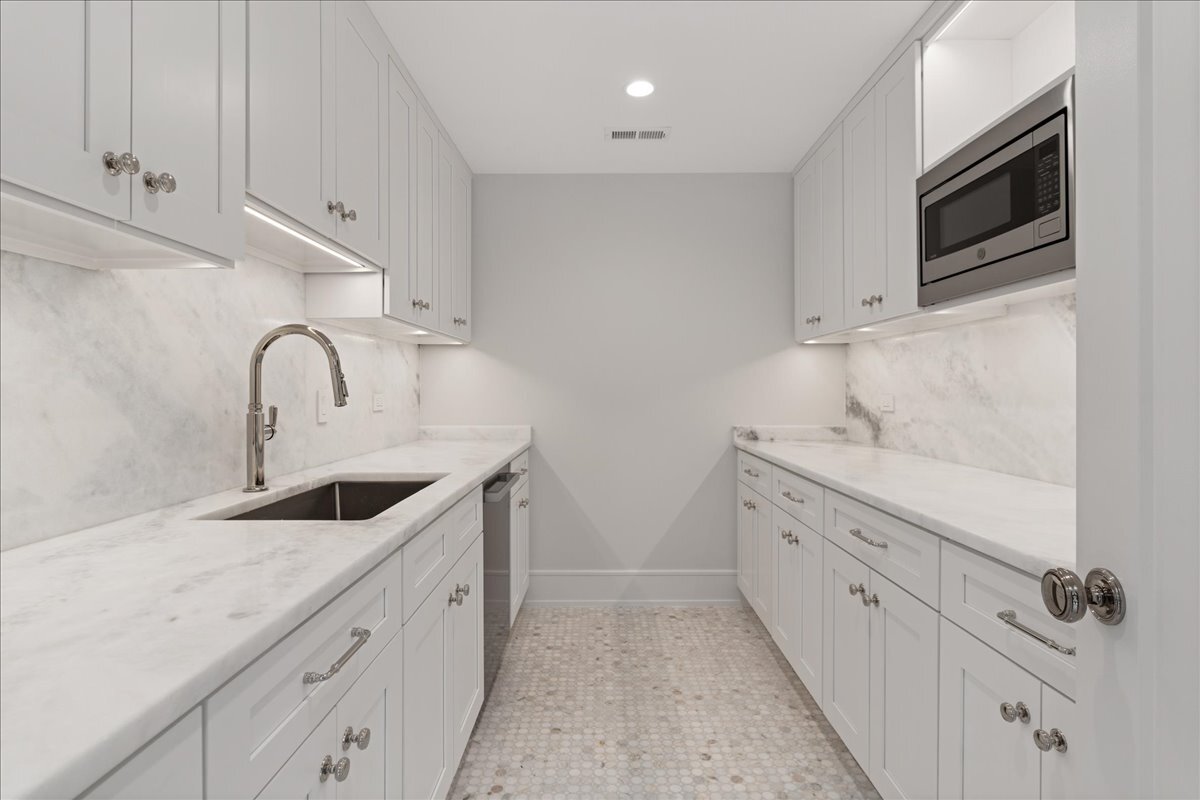819 Wagner Road Glenview, IL 60025 - Photo 8 of 20 a kitchen with granite countertop white cabinets and sink