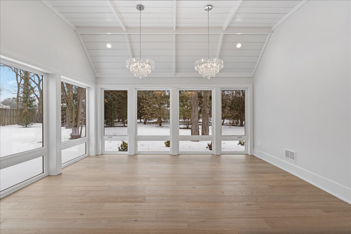 819 Wagner Road Glenview, IL 60025 - Photo 9 of 20 a view of an room with wooden floor and windows