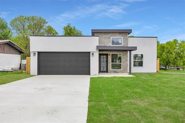 front view of a house with a garden