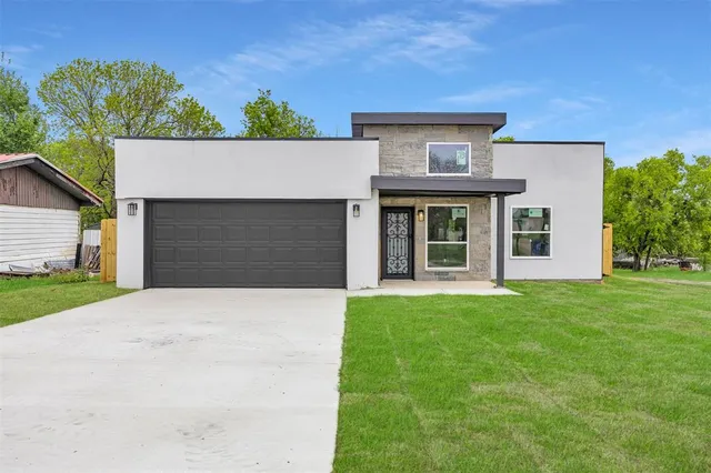 front view of a house with a garden