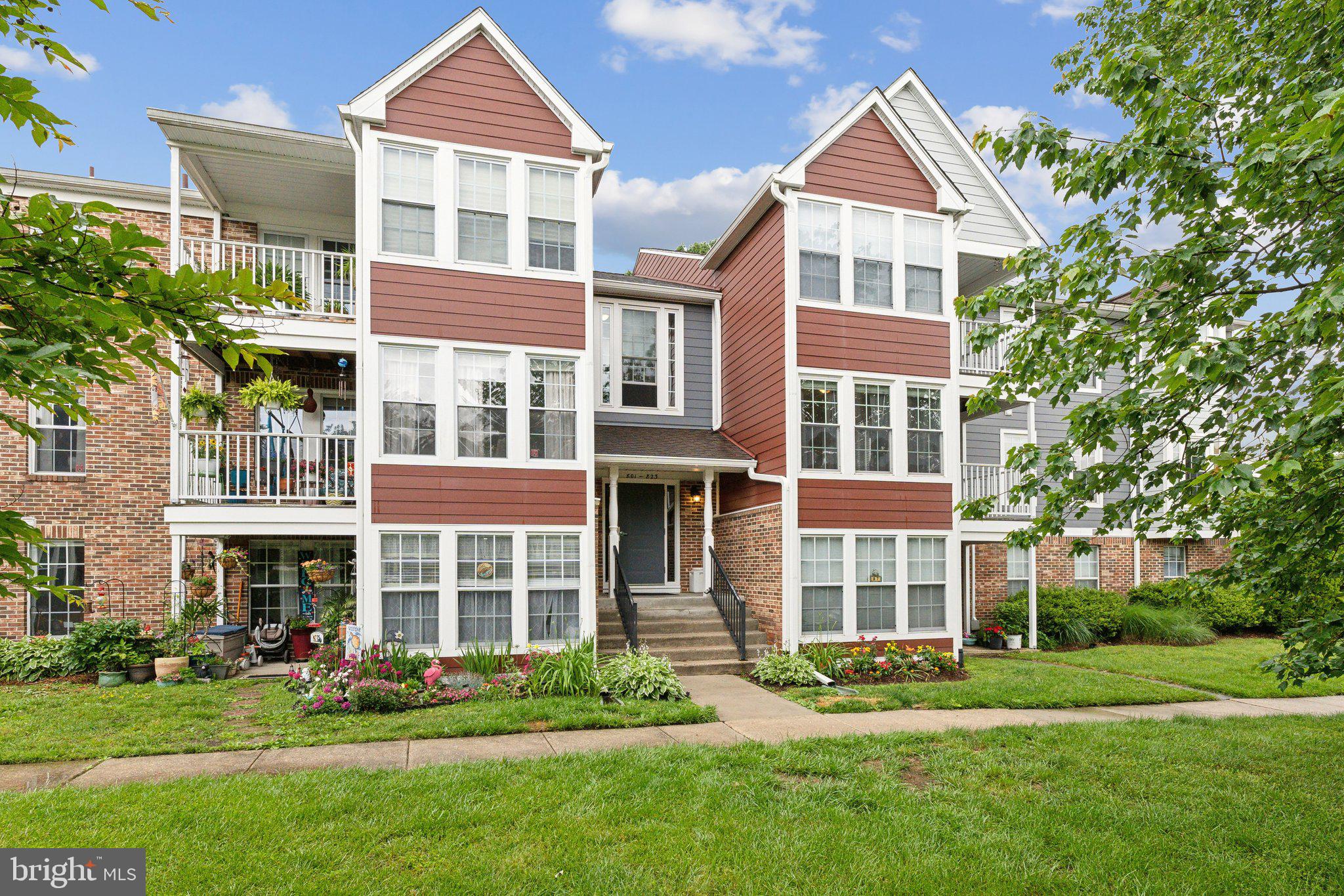 815 Deering Road, Unit 7H Pasadena, MD 21122 - Photo 1 of 24 front view of a building with a yard
