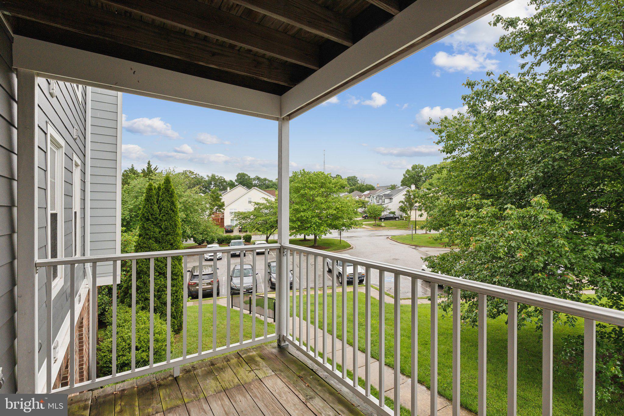 815 Deering Road, Unit 7H Pasadena, MD 21122 - Photo 12 of 24 a view of balcony with wooden floor