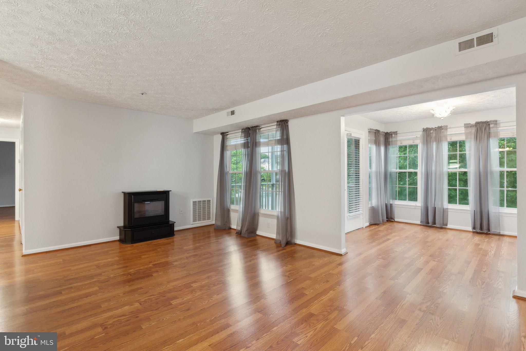 815 Deering Road, Unit 7H Pasadena, MD 21122 - Photo 24 of 24 a view of an empty room with glass door and balcony