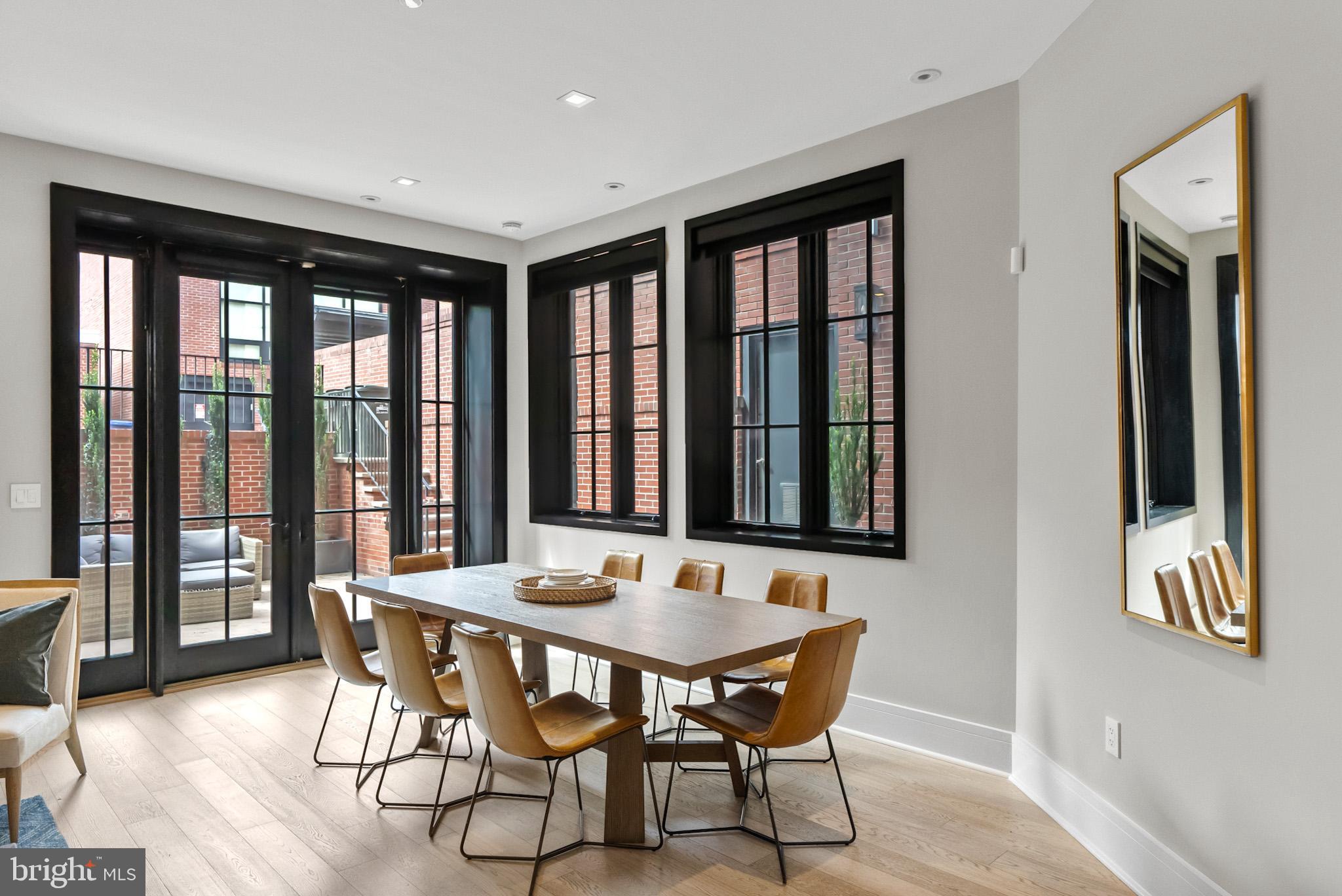 1310 Q Street Northwest, Unit 4 Washington, DC 20009 - Photo 5 of 24 a view of a dining room with furniture window and wooden floor
