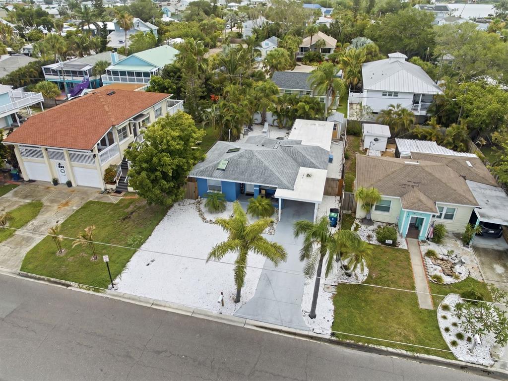 1207 1st Street Indian Rocks Beach, FL 33785 - Photo 41 of 60 an aerial view of multiple houses with yard