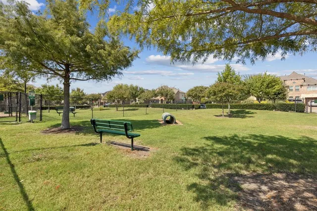 a park bench sitting in the middle of a park