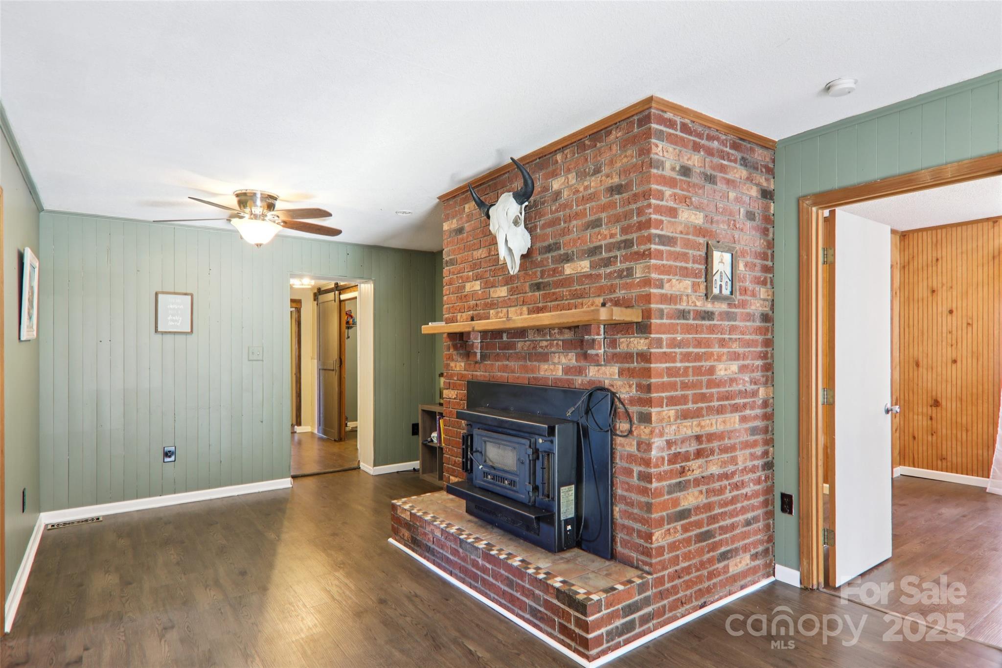 57 Bittersweet Trail Canton, NC 28716 - Photo 16 of 40 a living room with furniture and a fireplace