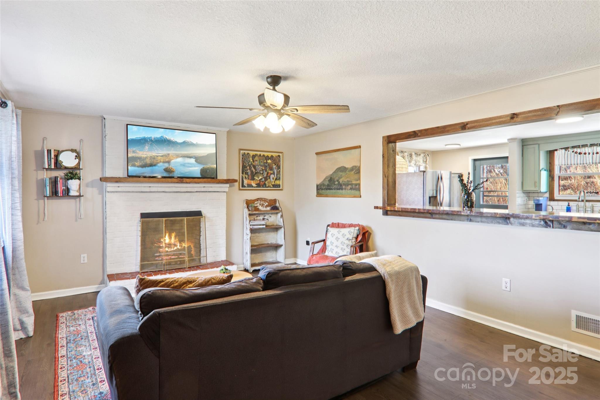 57 Bittersweet Trail Canton, NC 28716 - Photo 17 of 40 a bed room with a bed and a fireplace