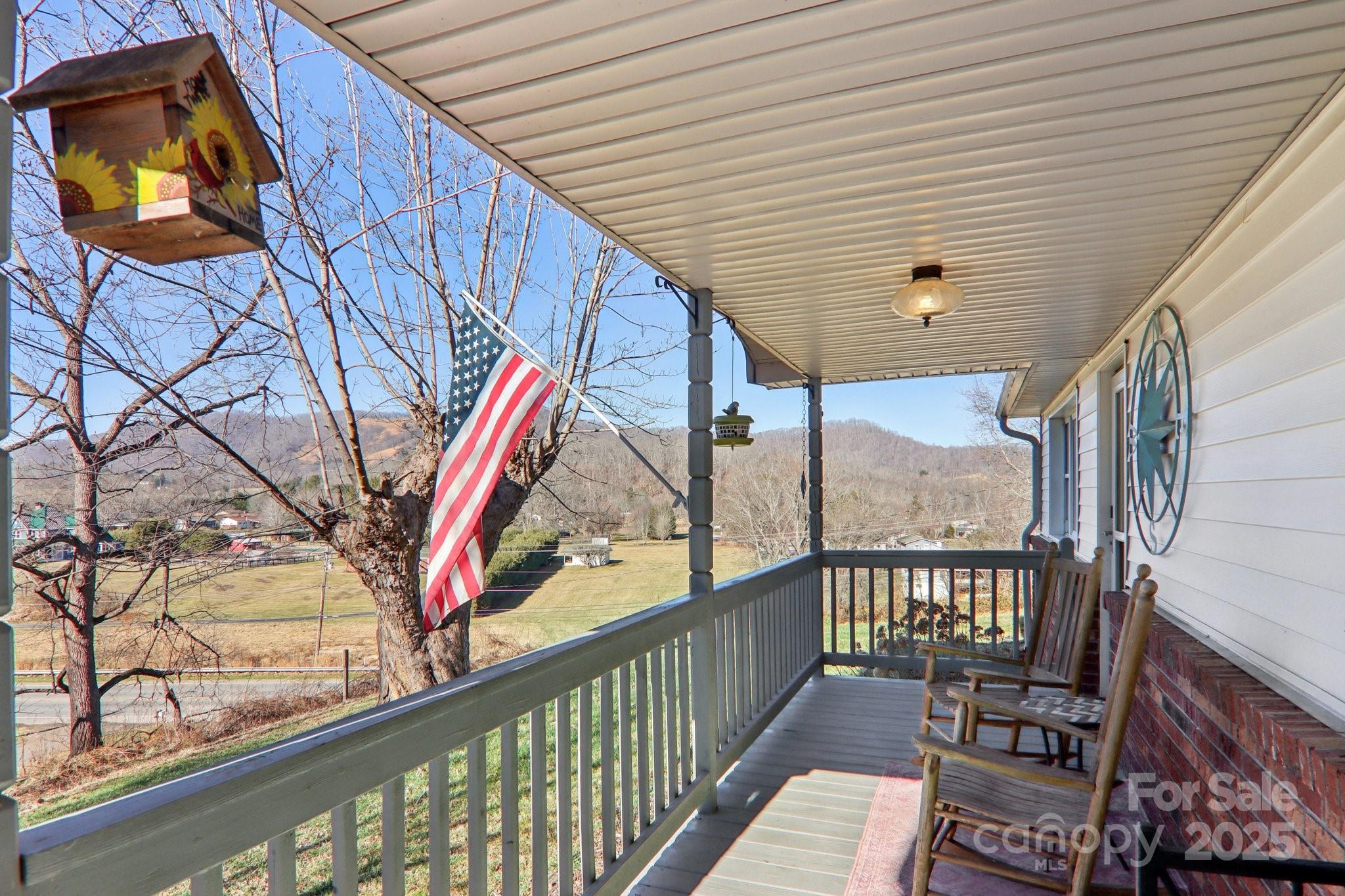 57 Bittersweet Trail Canton, NC 28716 - Photo 2 of 40 a view of a two chairs on the deck