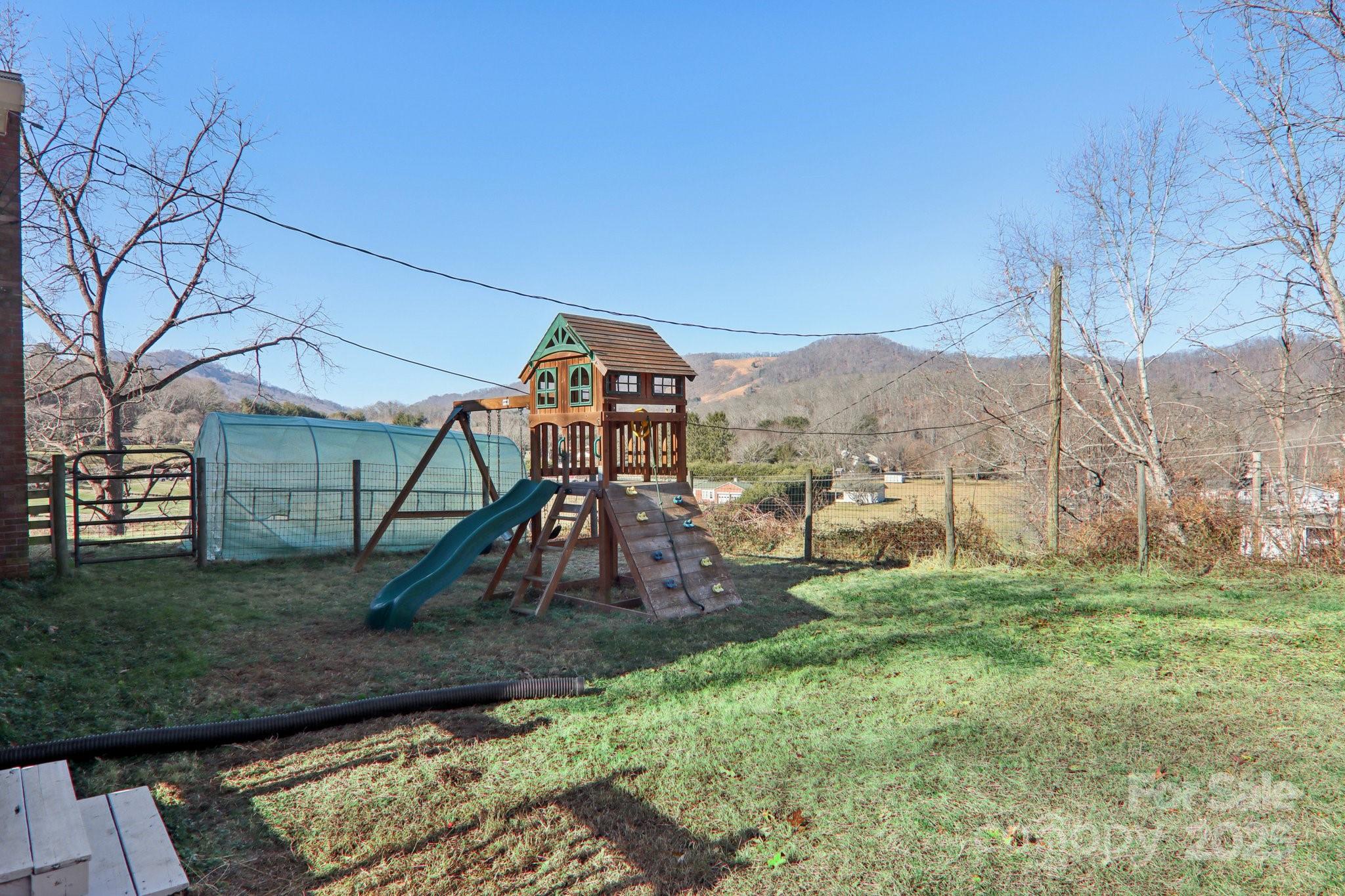 57 Bittersweet Trail Canton, NC 28716 - Photo 34 of 40 a view of a garden with a slide