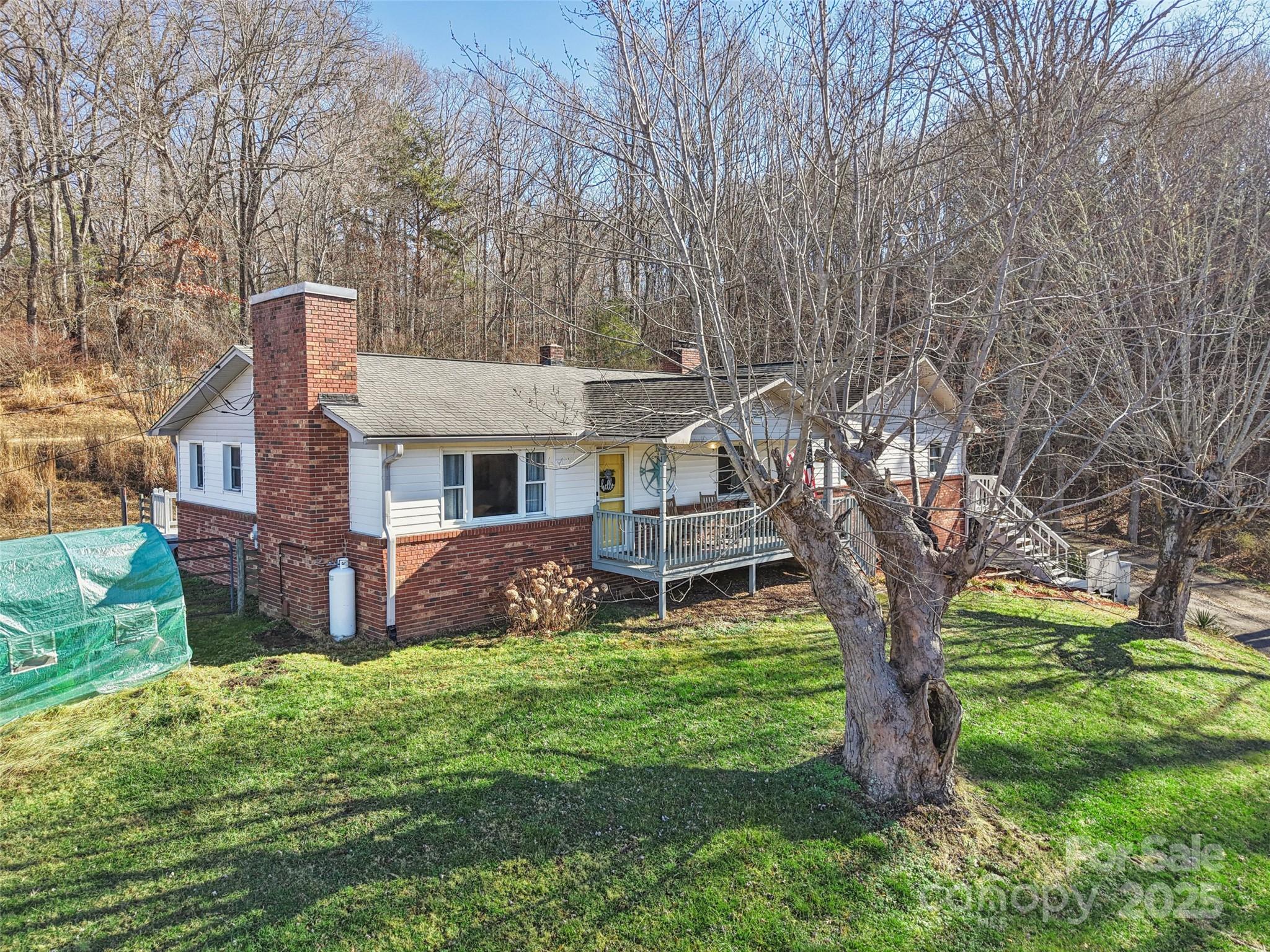 57 Bittersweet Trail Canton, NC 28716 - Photo 37 of 40 a front view of a house with garden