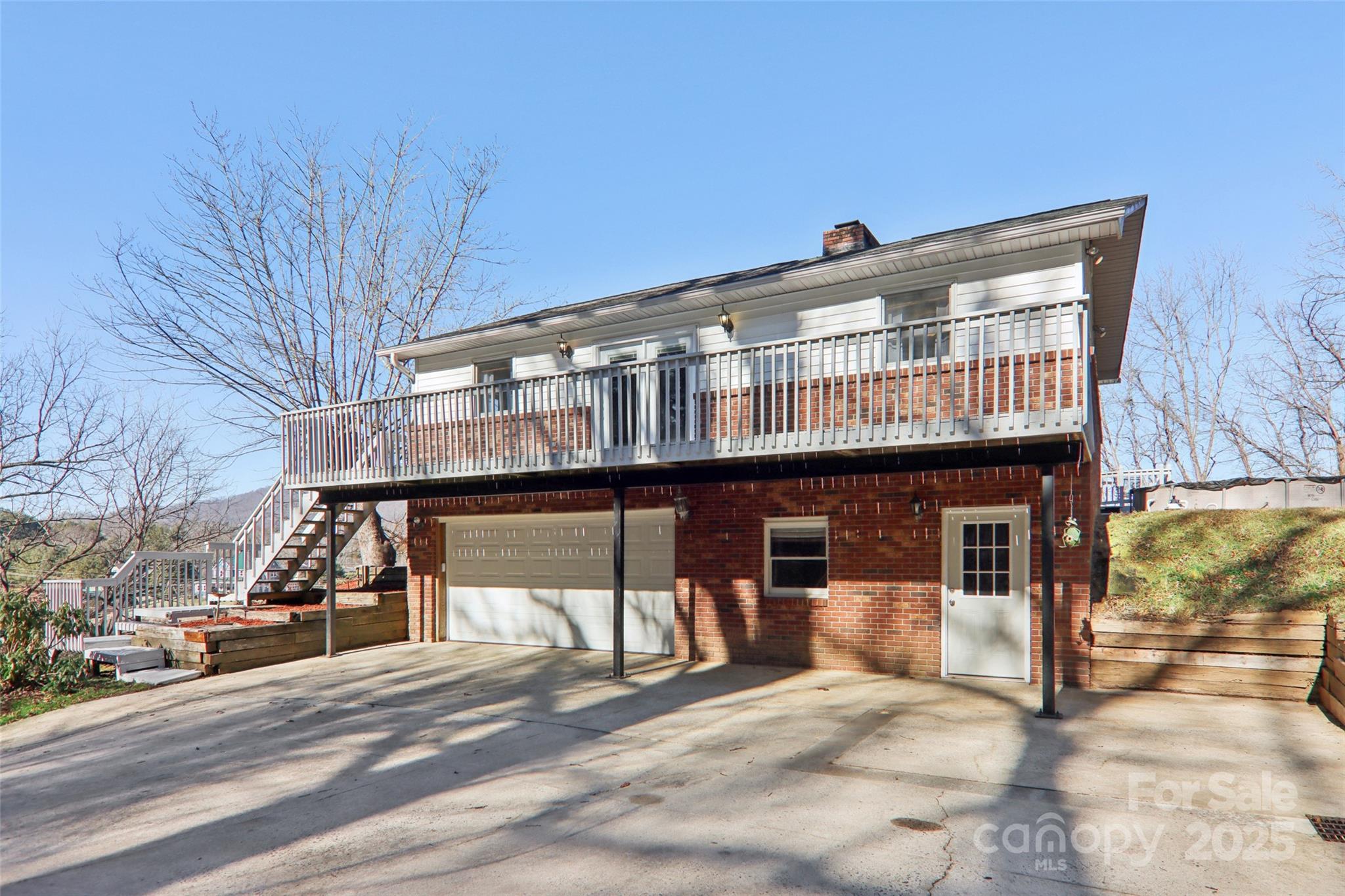 57 Bittersweet Trail Canton, NC 28716 - Photo 4 of 40 a front view of a building with glass windows