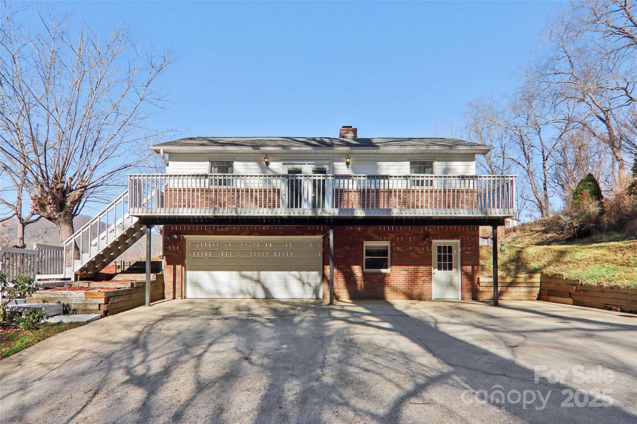 57 Bittersweet Trail Canton, NC 28716 - Photo 5 of 40 a front view of a building with street