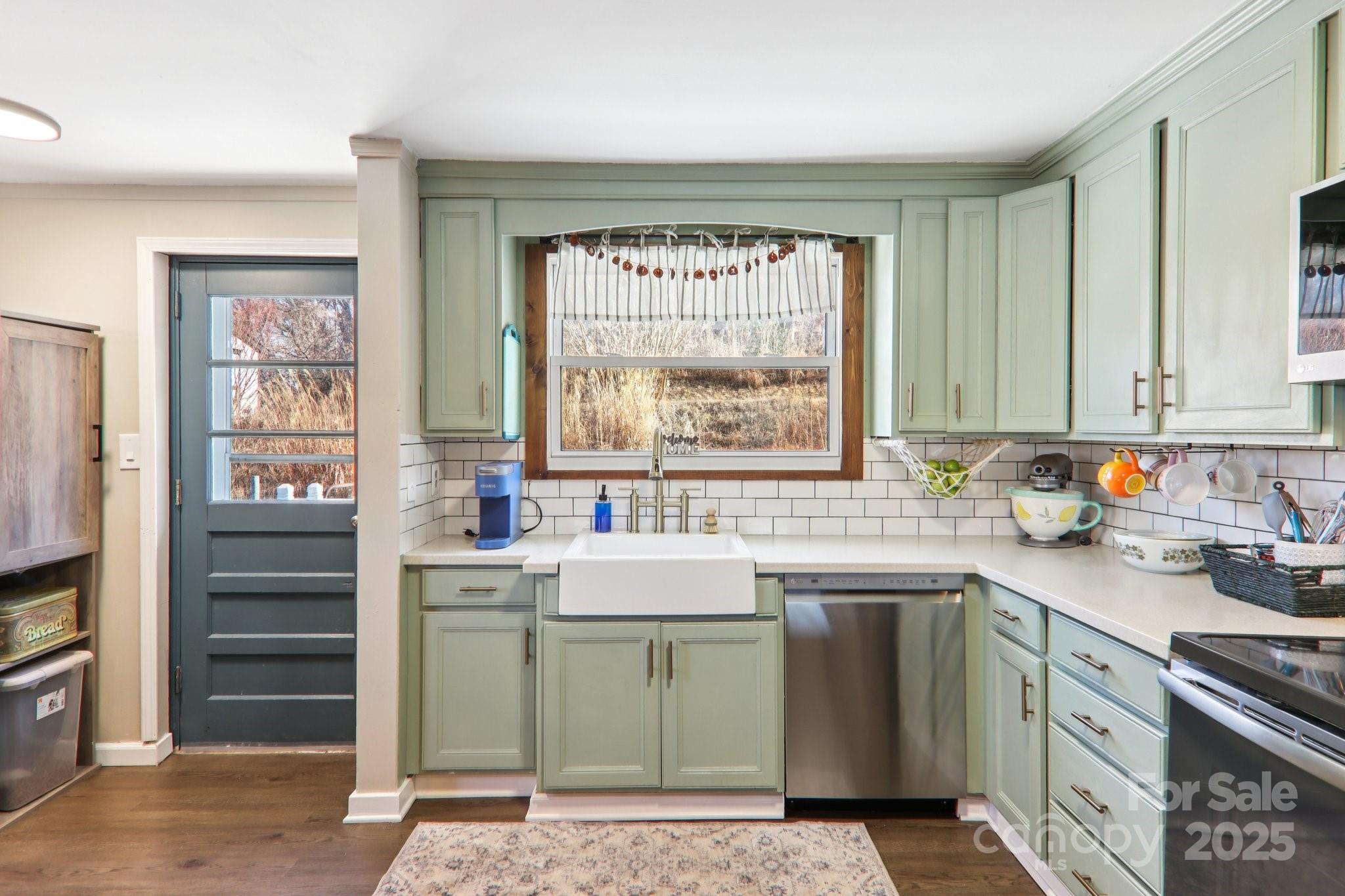 57 Bittersweet Trail Canton, NC 28716 - Photo 7 of 40 a kitchen with a sink stove and cabinets
