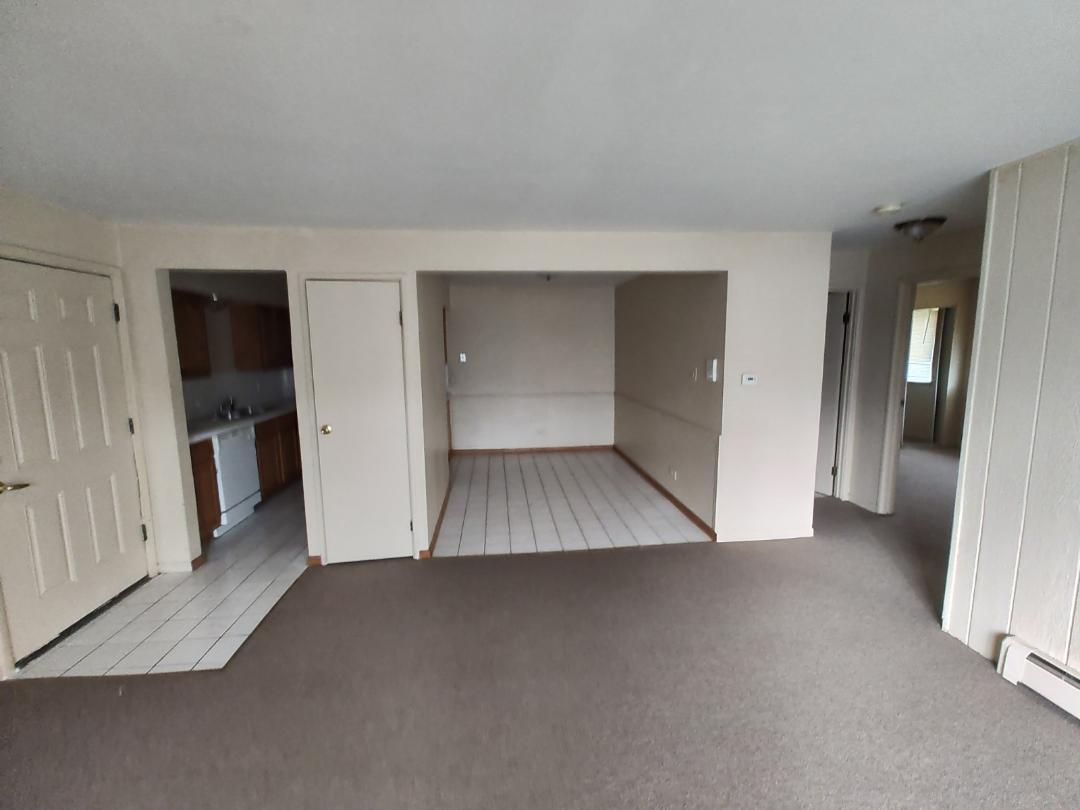 4839 West Engle Road, Unit 2C Alsip, IL 60803 - Photo 4 of 13 an empty room with a wooden shelves