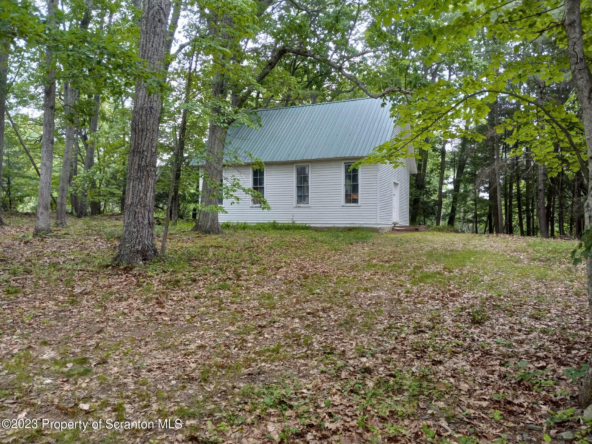 Mill Lane Tunkhannock, PA 18657 - Photo 6 of 6 a view of a house with a yard and large trees