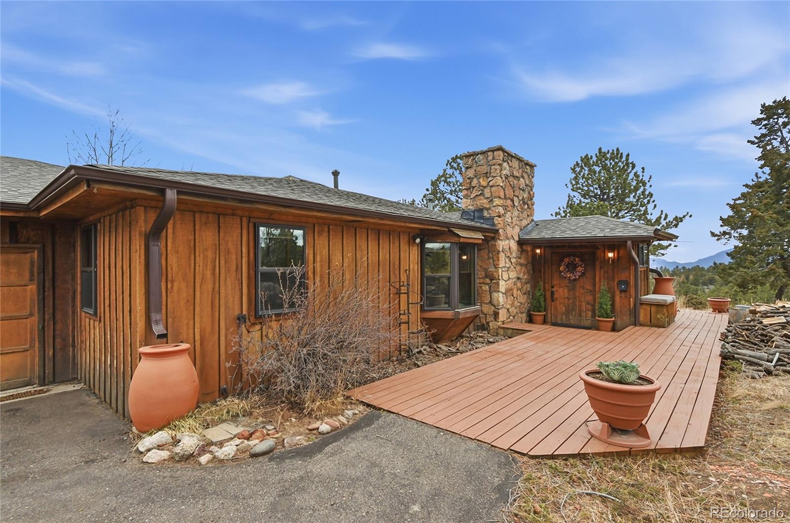 13082 South Wamblee Valley Road Conifer, CO 80433 - Photo 35 of 35 a front view of house with outdoor seating