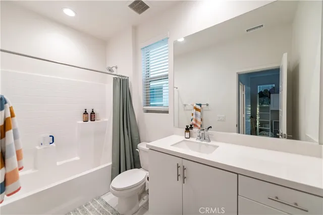 a bedroom with a bed and a table