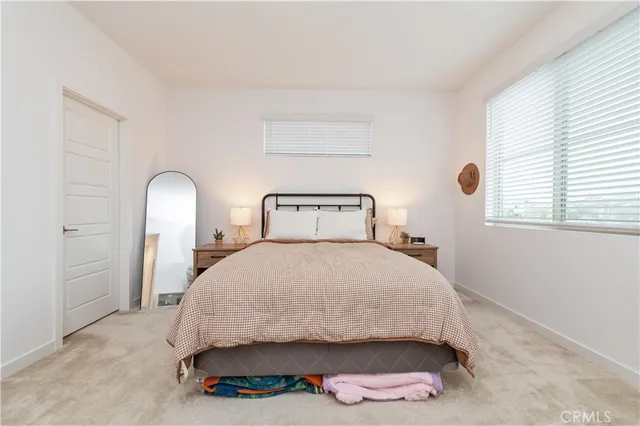 a bathroom with double sink and a mirror