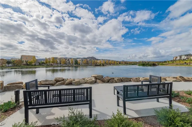 a view of balcony with wooden floor and seating space