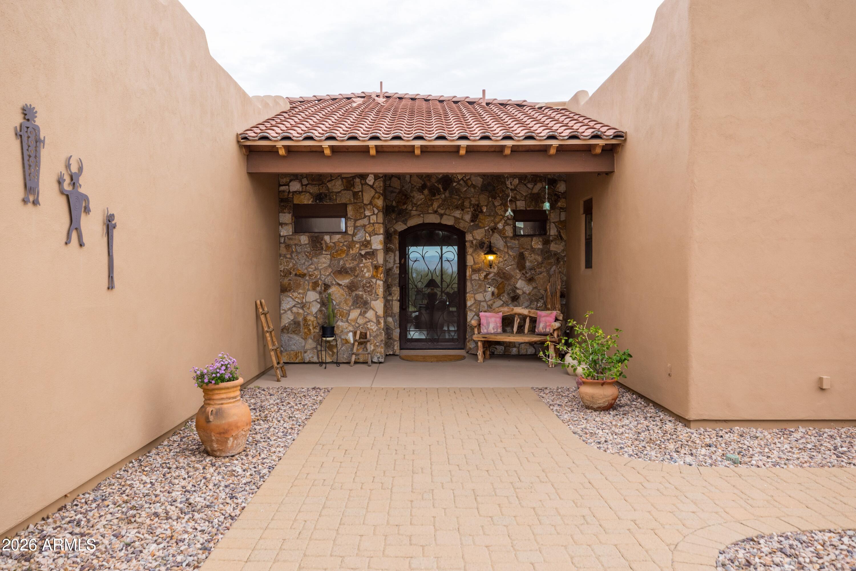 13906 East Montello Road Scottsdale, AZ 85262 - Photo 15 of 110 a front view of a house with entryway