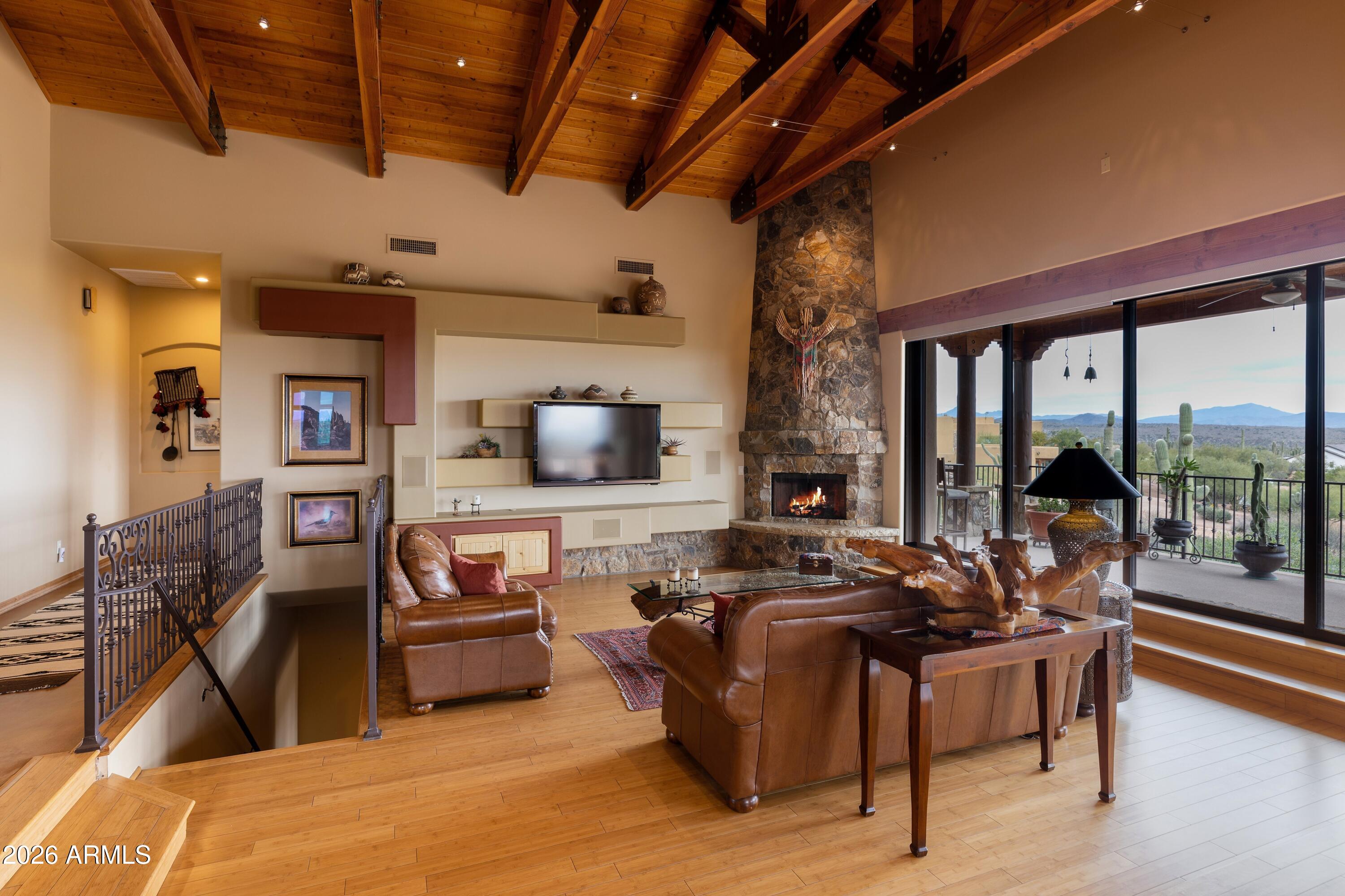 13906 East Montello Road Scottsdale, AZ 85262 - Photo 19 of 110 a living room with furniture and a flat screen tv