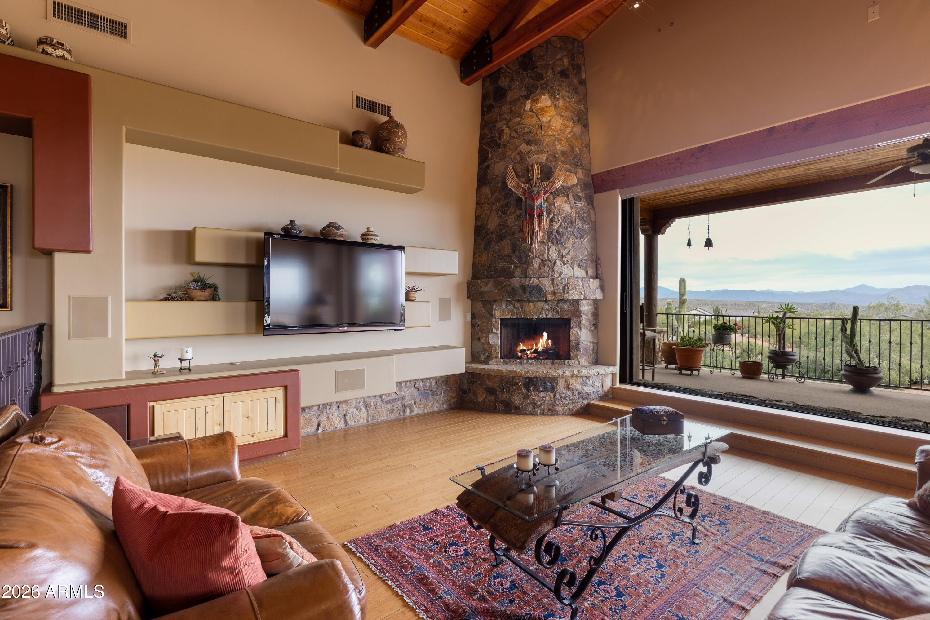 13906 East Montello Road Scottsdale, AZ 85262 - Photo 20 of 110 a living room with furniture and a flat screen tv