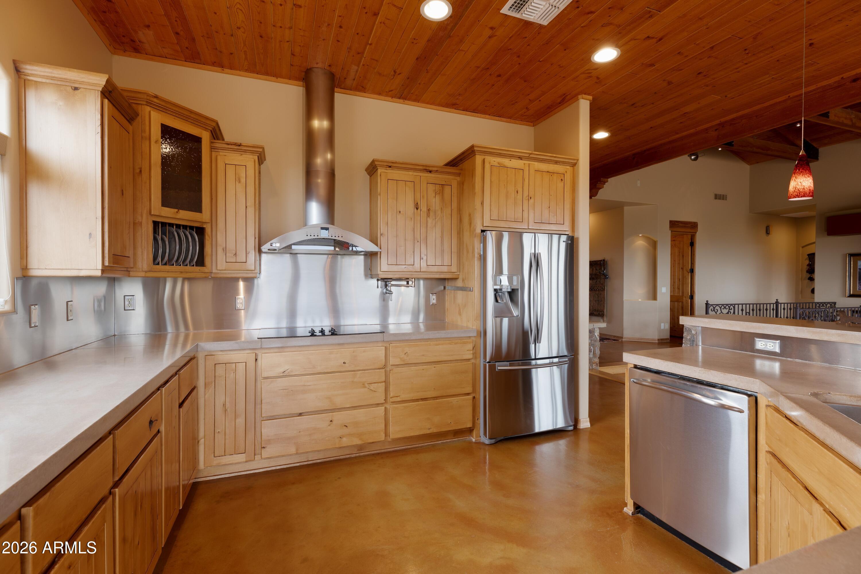 13906 East Montello Road Scottsdale, AZ 85262 - Photo 25 of 110 a kitchen with stainless steel appliances granite countertop a refrigerator and a sink