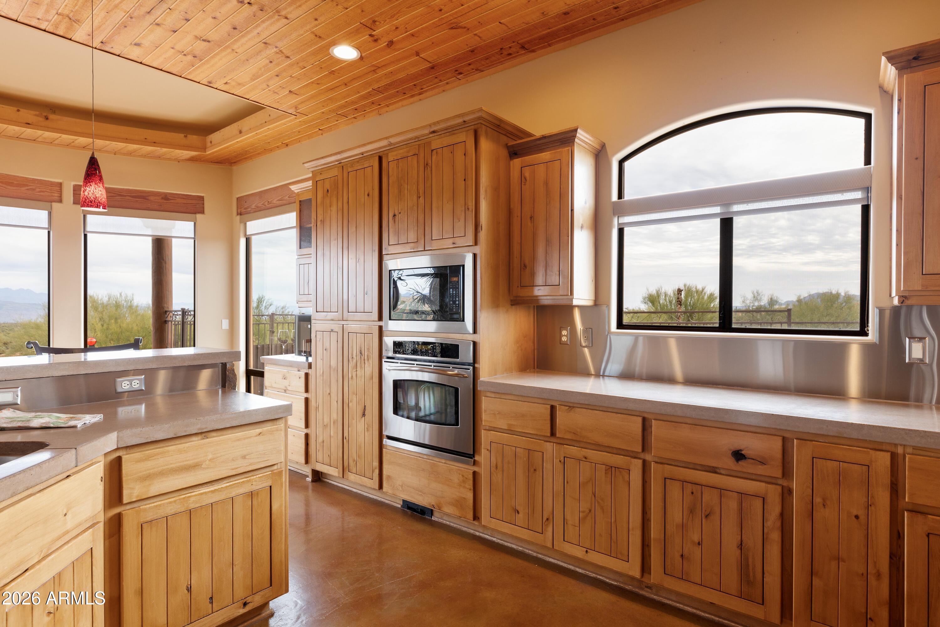 13906 East Montello Road Scottsdale, AZ 85262 - Photo 27 of 110 a kitchen with granite countertop a refrigerator and a sink