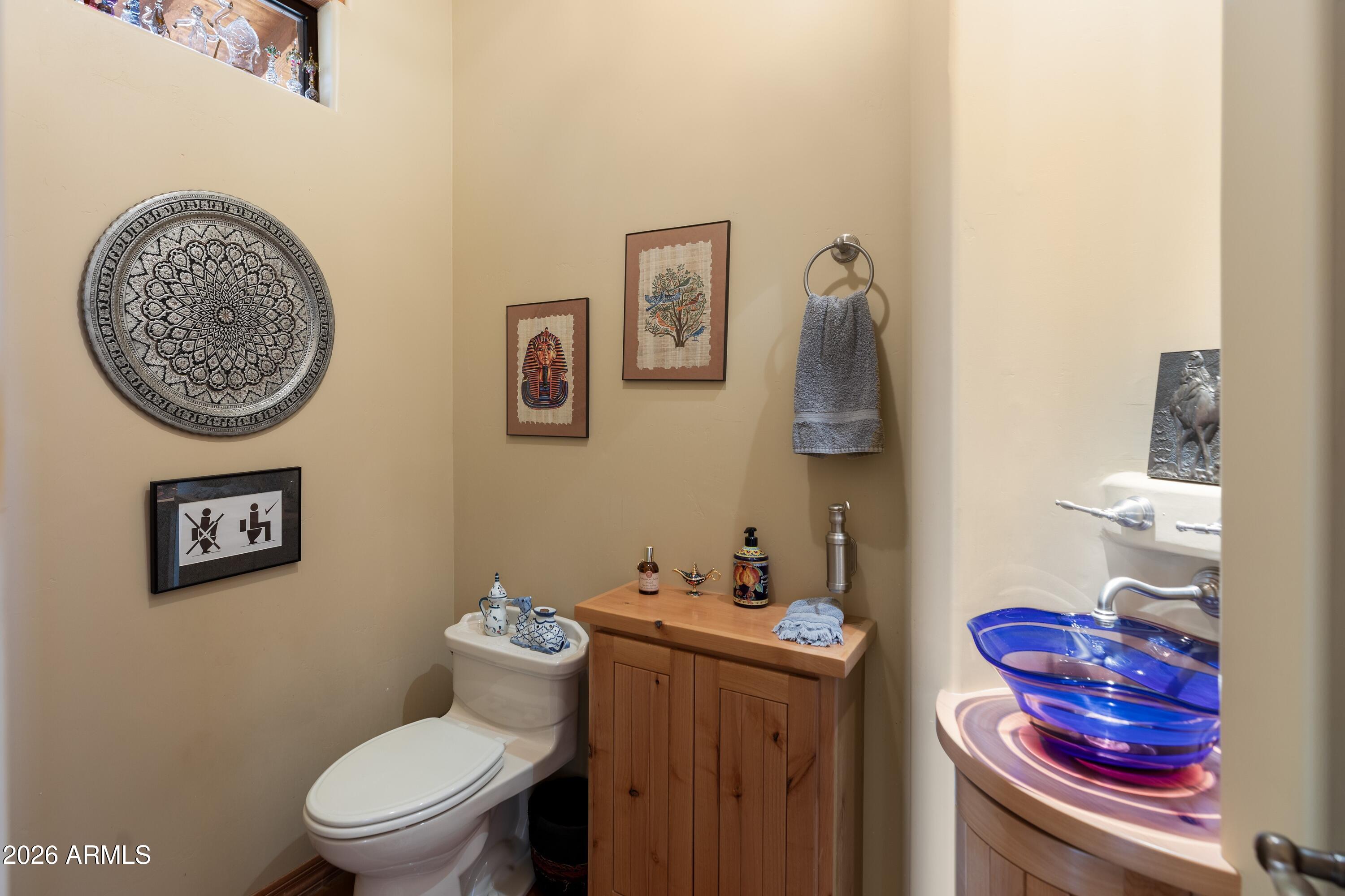 13906 East Montello Road Scottsdale, AZ 85262 - Photo 30 of 110 a bathroom with a toilet and a sink