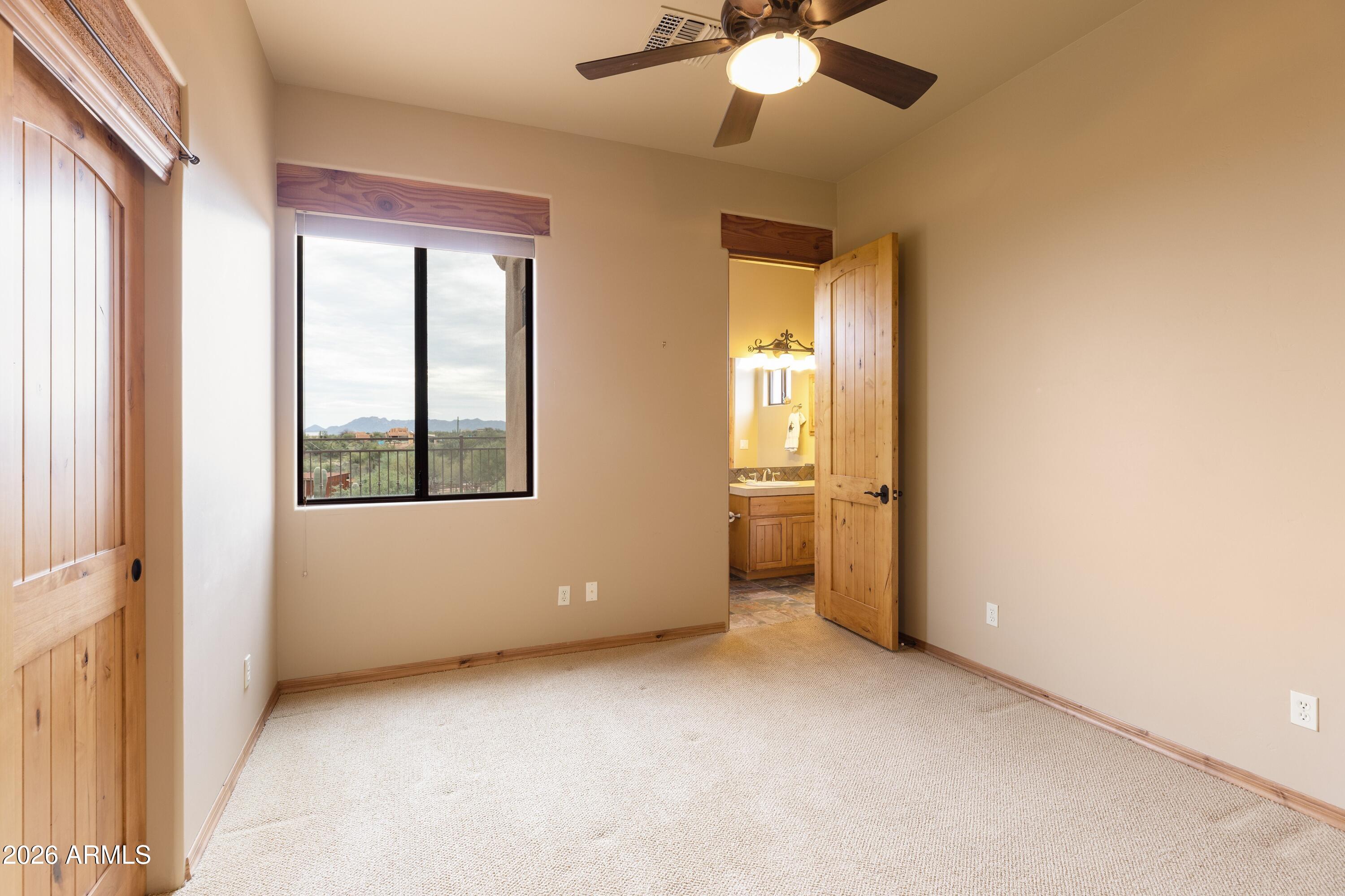 13906 East Montello Road Scottsdale, AZ 85262 - Photo 35 of 110 a view of an empty room with a window