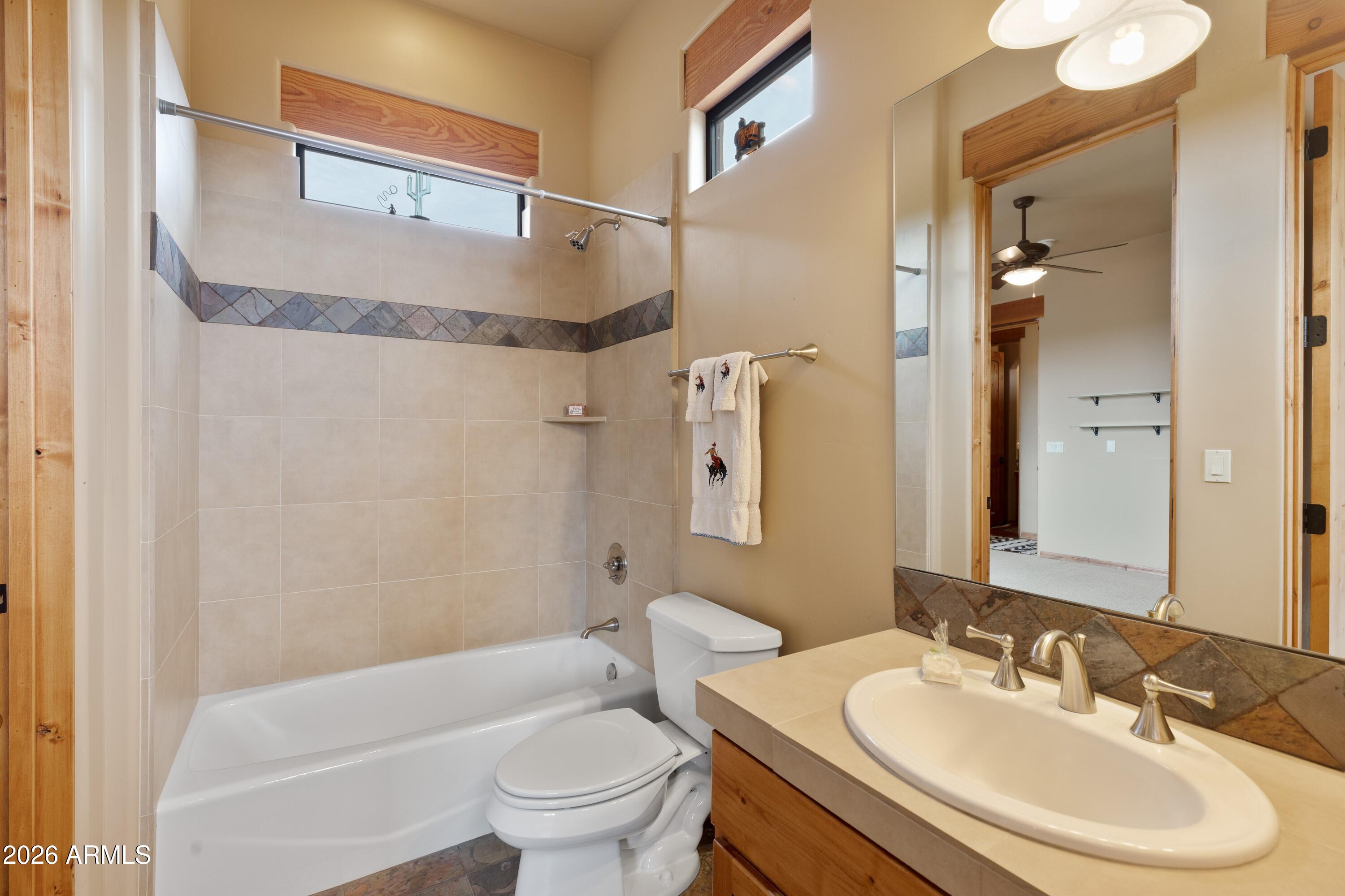 13906 East Montello Road Scottsdale, AZ 85262 - Photo 36 of 110 a bathroom with a sink toilet and shower