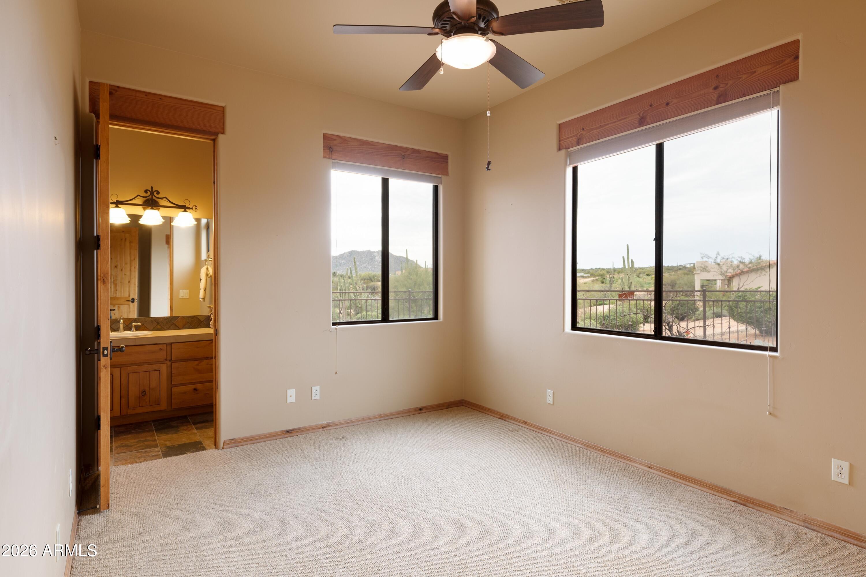 13906 East Montello Road Scottsdale, AZ 85262 - Photo 39 of 110 an empty room with windows and fan