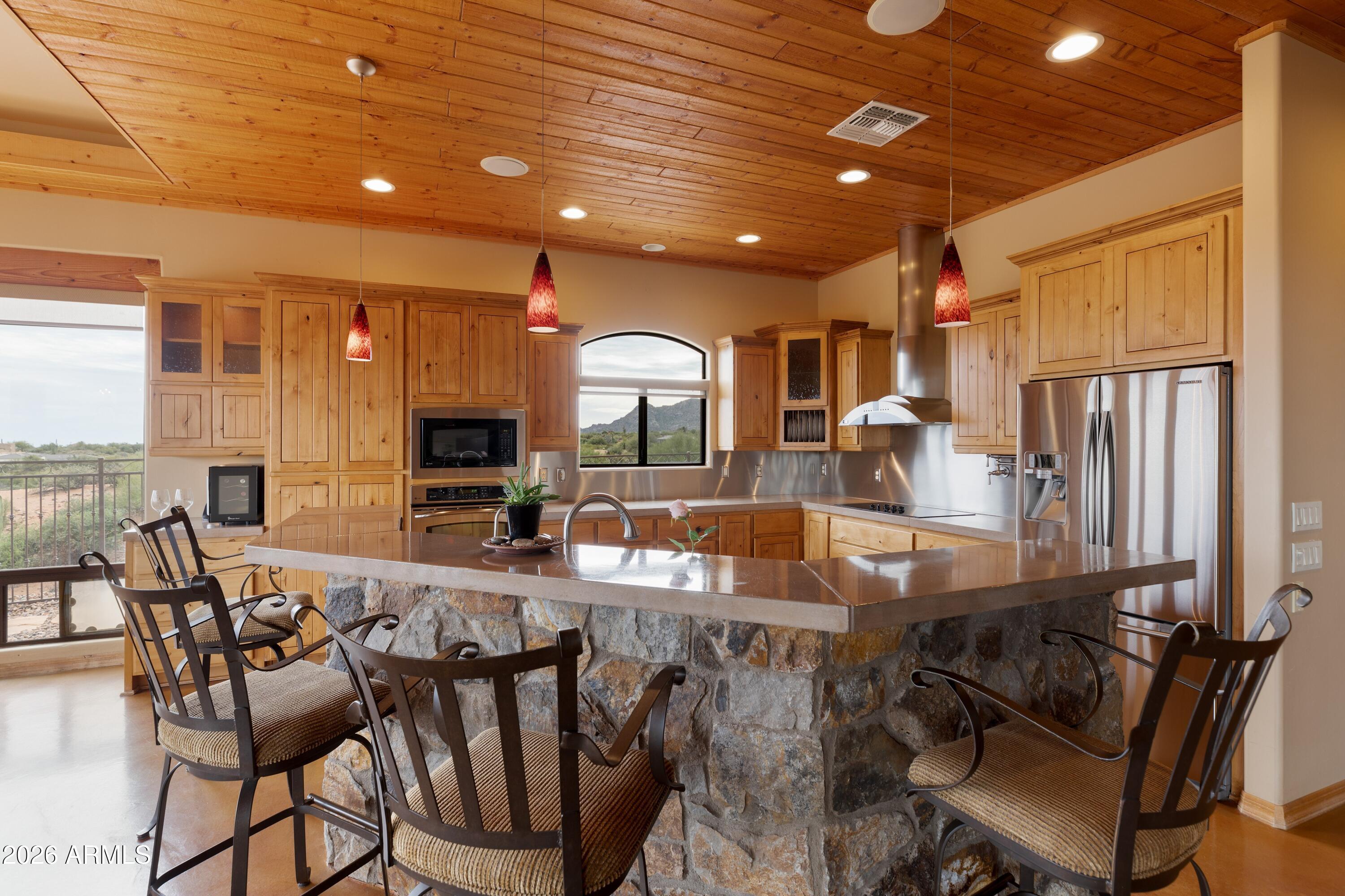 13906 East Montello Road Scottsdale, AZ 85262 - Photo 4 of 110 a view of a dining room with furniture window and wooden floor