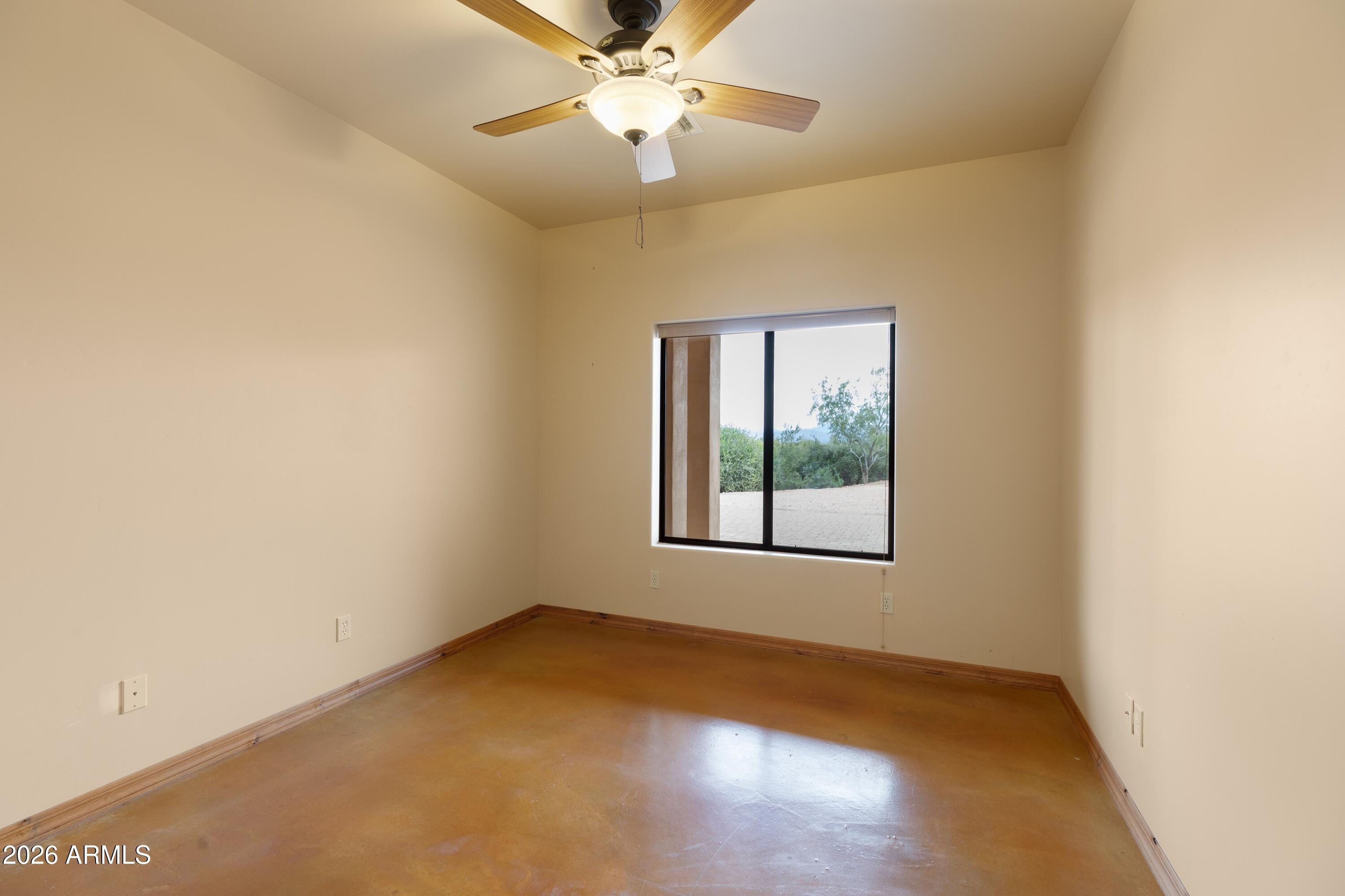 13906 East Montello Road Scottsdale, AZ 85262 - Photo 44 of 110 an empty room with a window and a fan