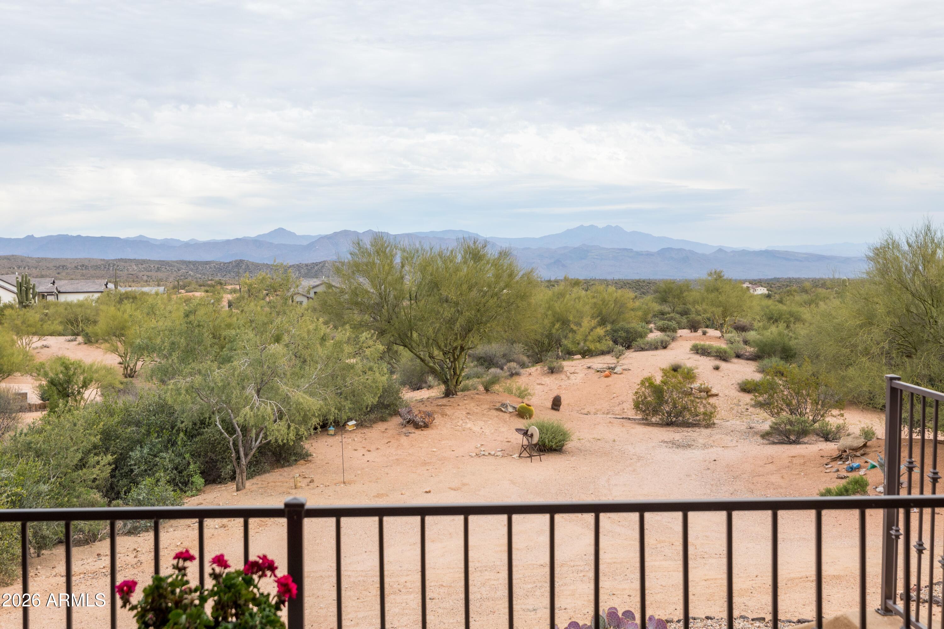 13906 East Montello Road Scottsdale, AZ 85262 - Photo 49 of 110 a view of a balcony with wooden floor and a bench