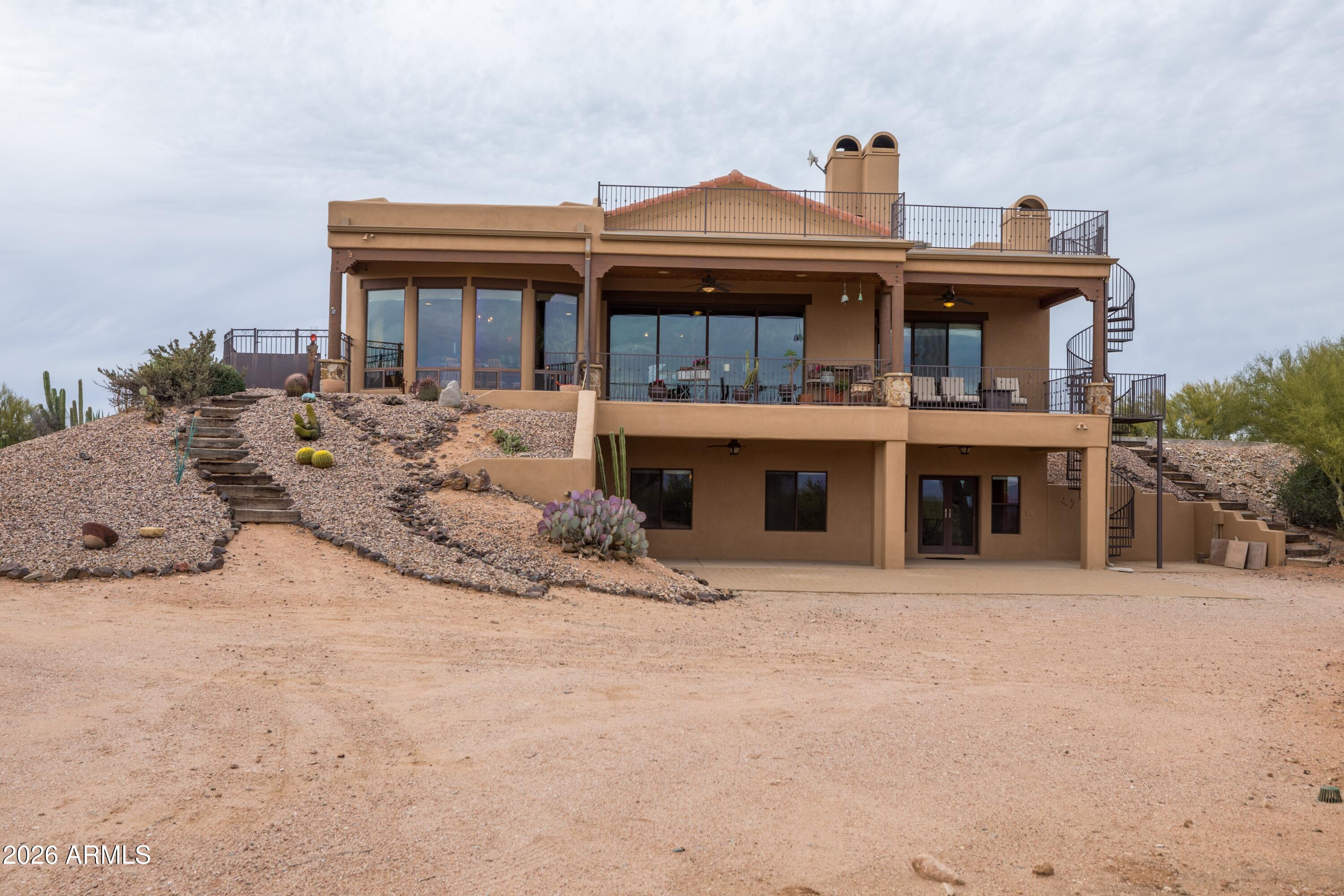 13906 East Montello Road Scottsdale, AZ 85262 - Photo 59 of 110 a front view of a house with a yard and garage