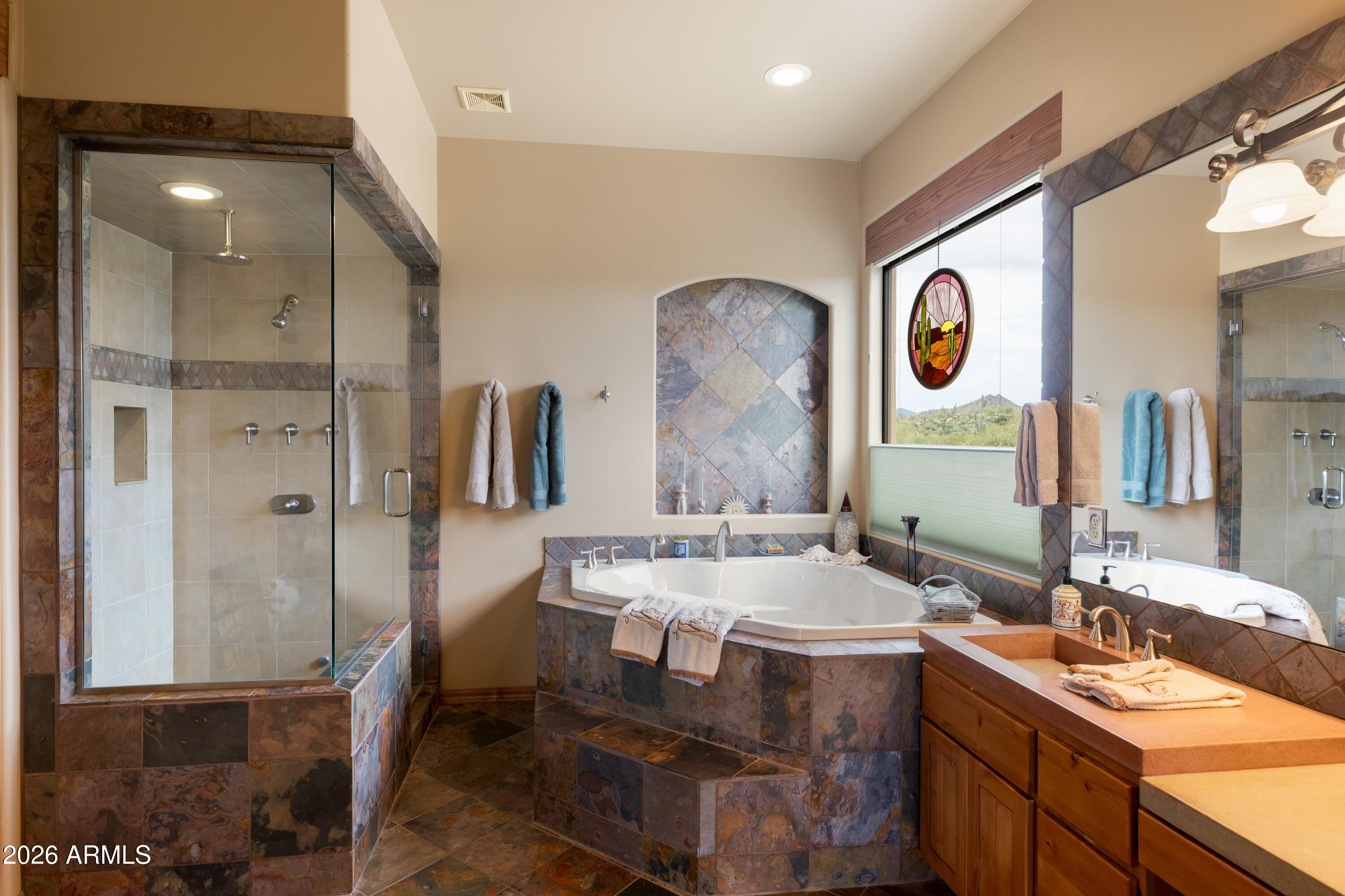 13906 East Montello Road Scottsdale, AZ 85262 - Photo 6 of 110 a bathroom with a sink and a mirror
