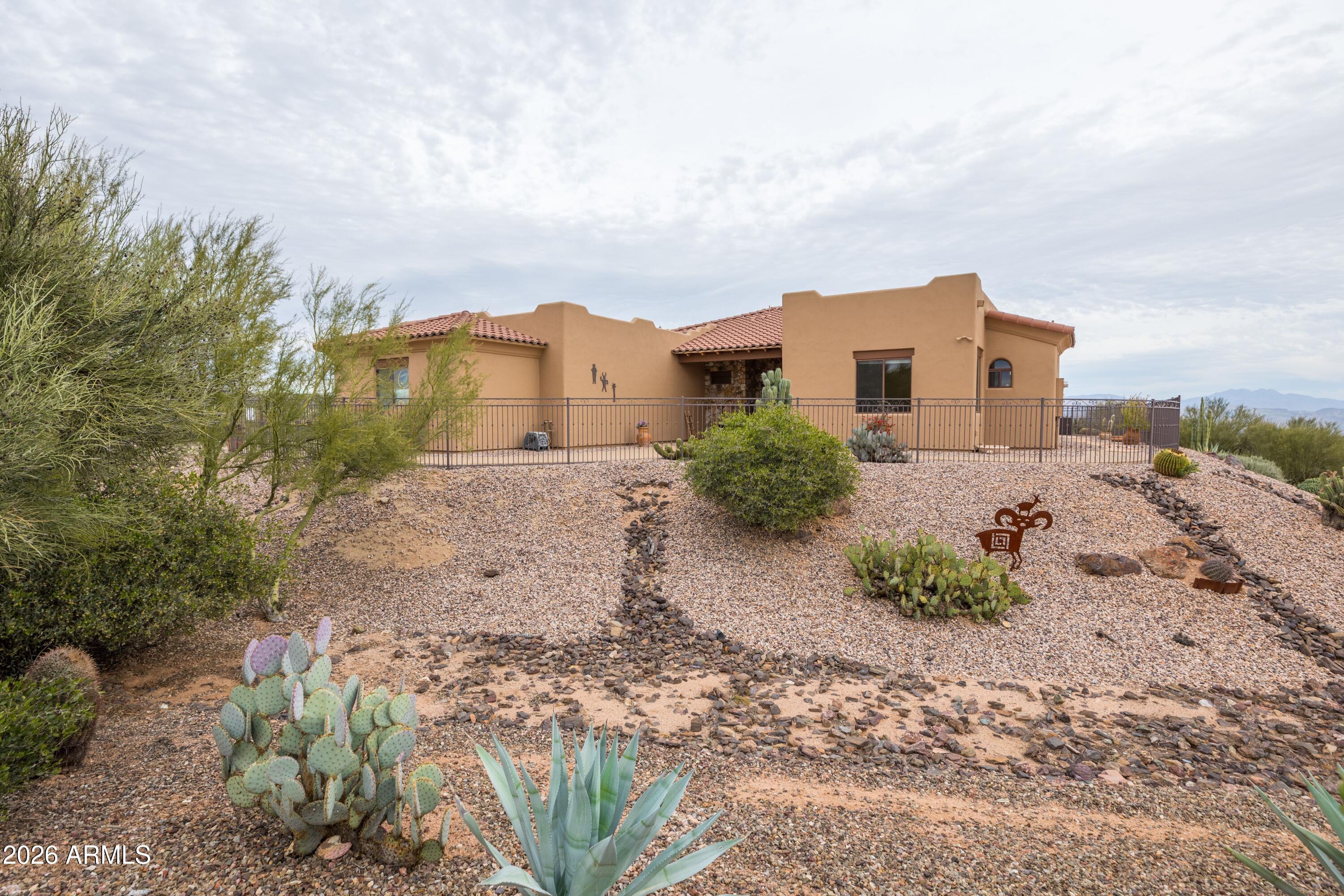 13906 East Montello Road Scottsdale, AZ 85262 - Photo 66 of 110 a view of a dry yard with wooden fence