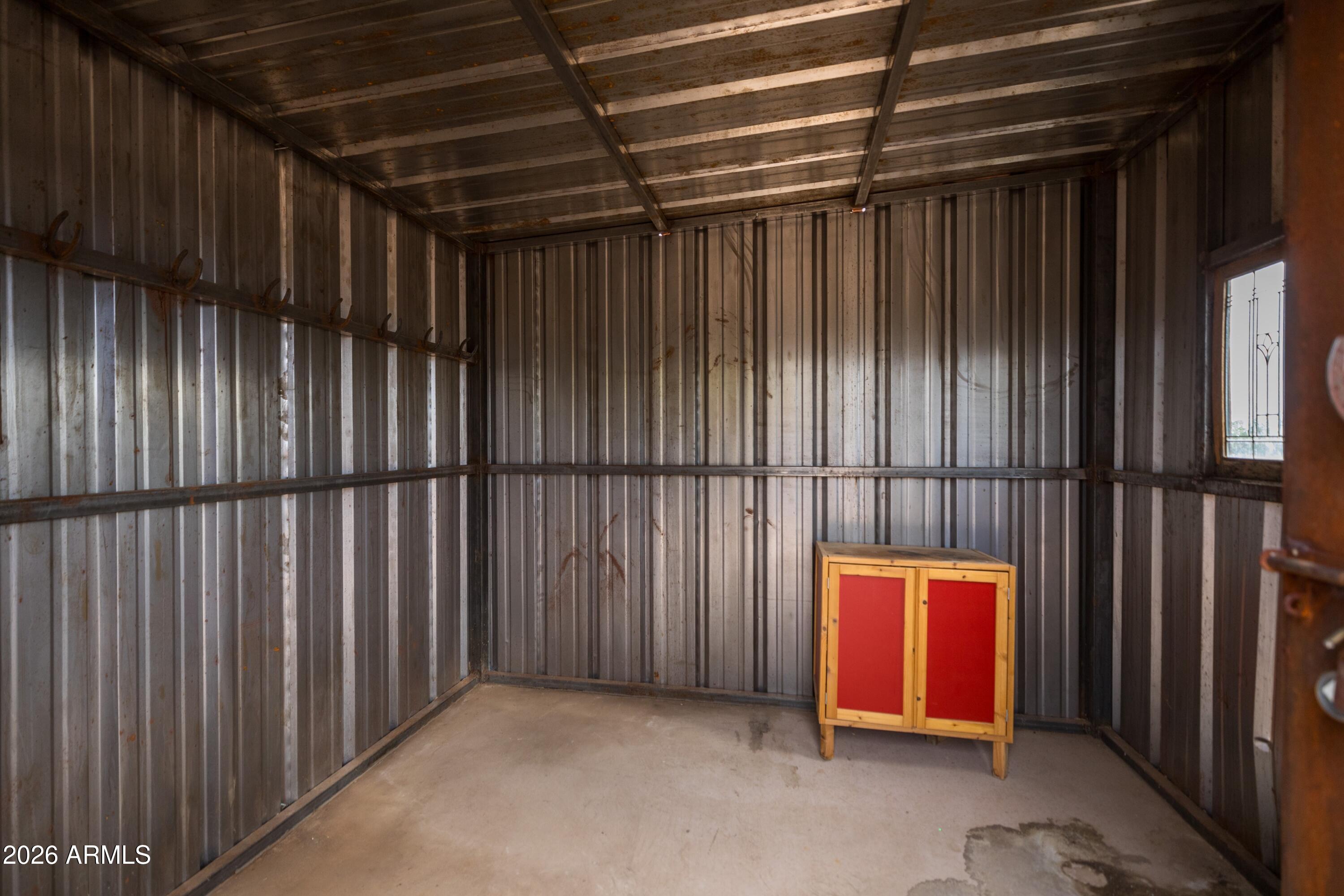 13906 East Montello Road Scottsdale, AZ 85262 - Photo 77 of 110 a view of an empty room with wooden floor