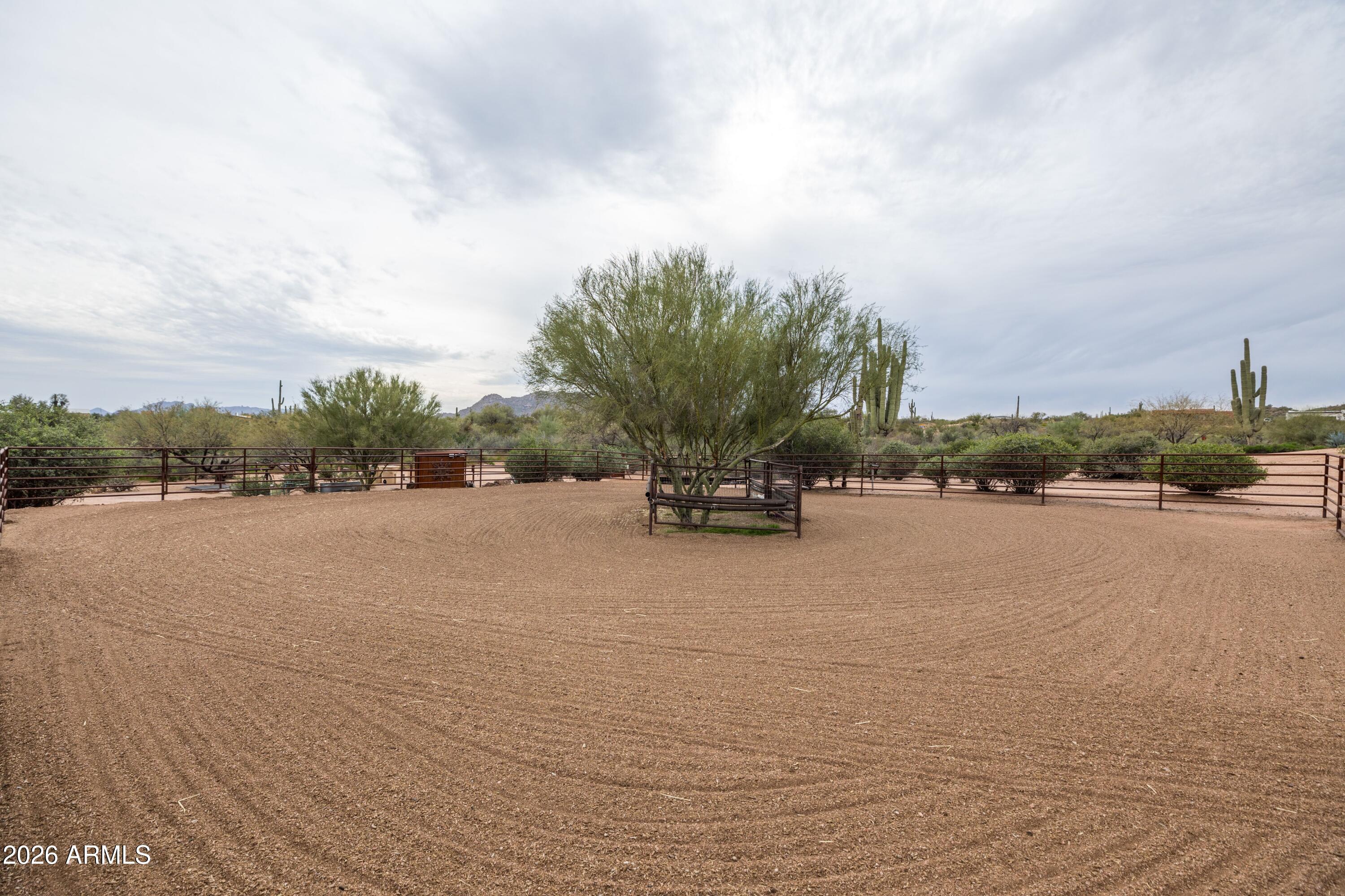 13906 East Montello Road Scottsdale, AZ 85262 - Photo 10 of 110 a car driving down a road next to a building