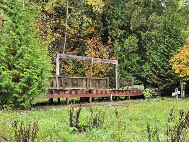 a view of park with wooden fence