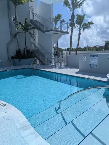 a view of a lake with furniture