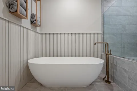 a white tub sitting in a bathroom