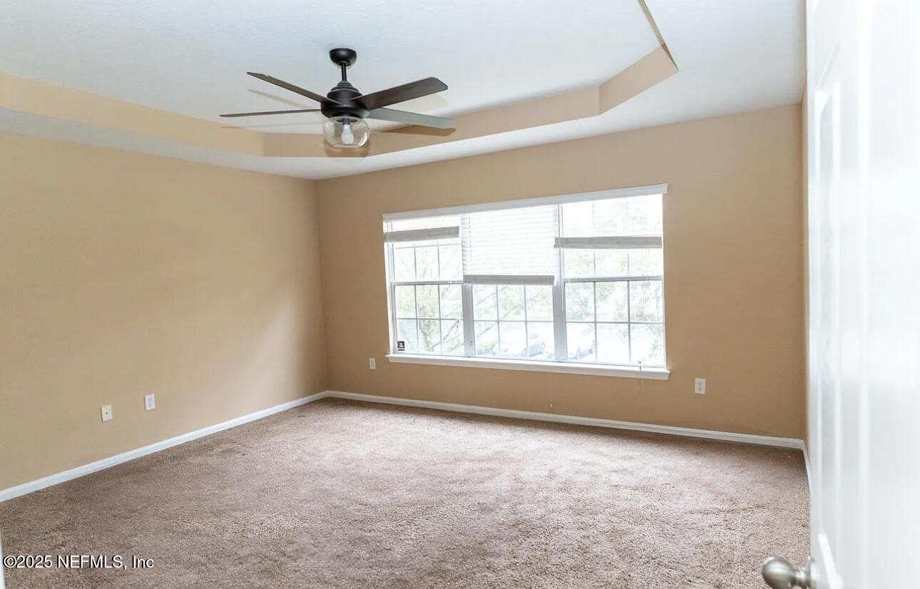 4204 Metron Drive Jacksonville, FL 32216 - Photo 11 of 24 a view of room with window and ceiling fan