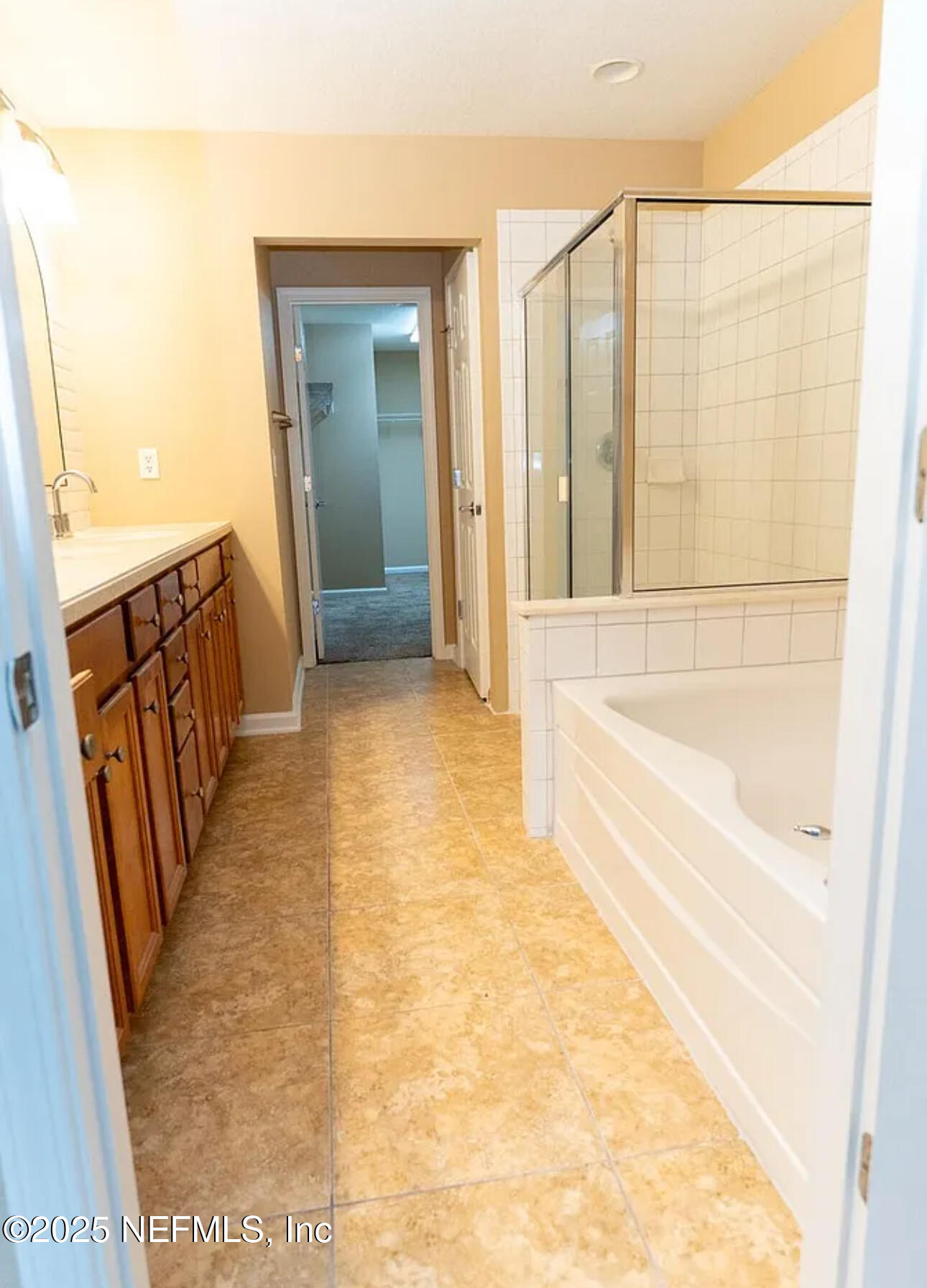 4204 Metron Drive Jacksonville, FL 32216 - Photo 13 of 24 a bathroom with a bathtub and a shower