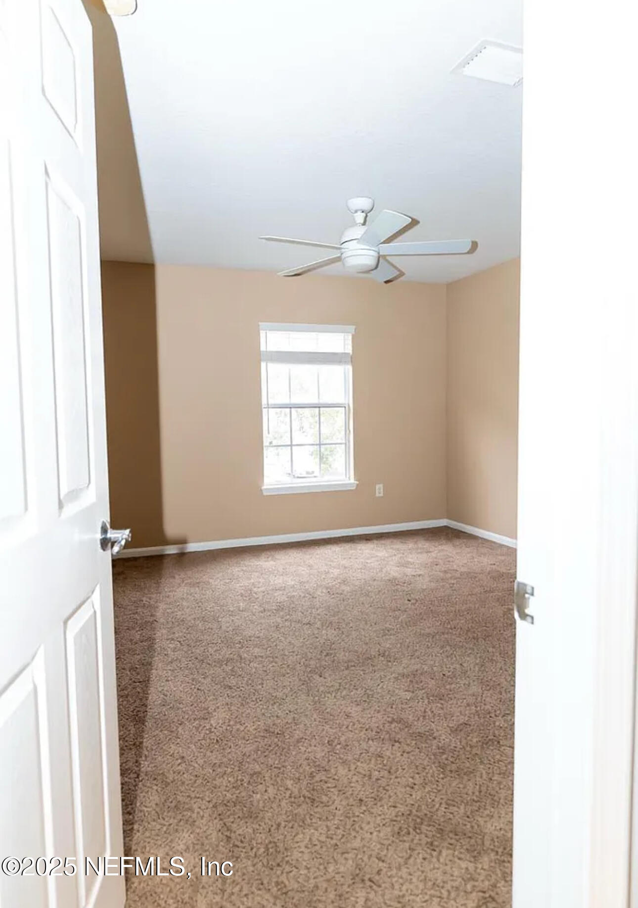 4204 Metron Drive Jacksonville, FL 32216 - Photo 15 of 24 a view of an empty room with a window