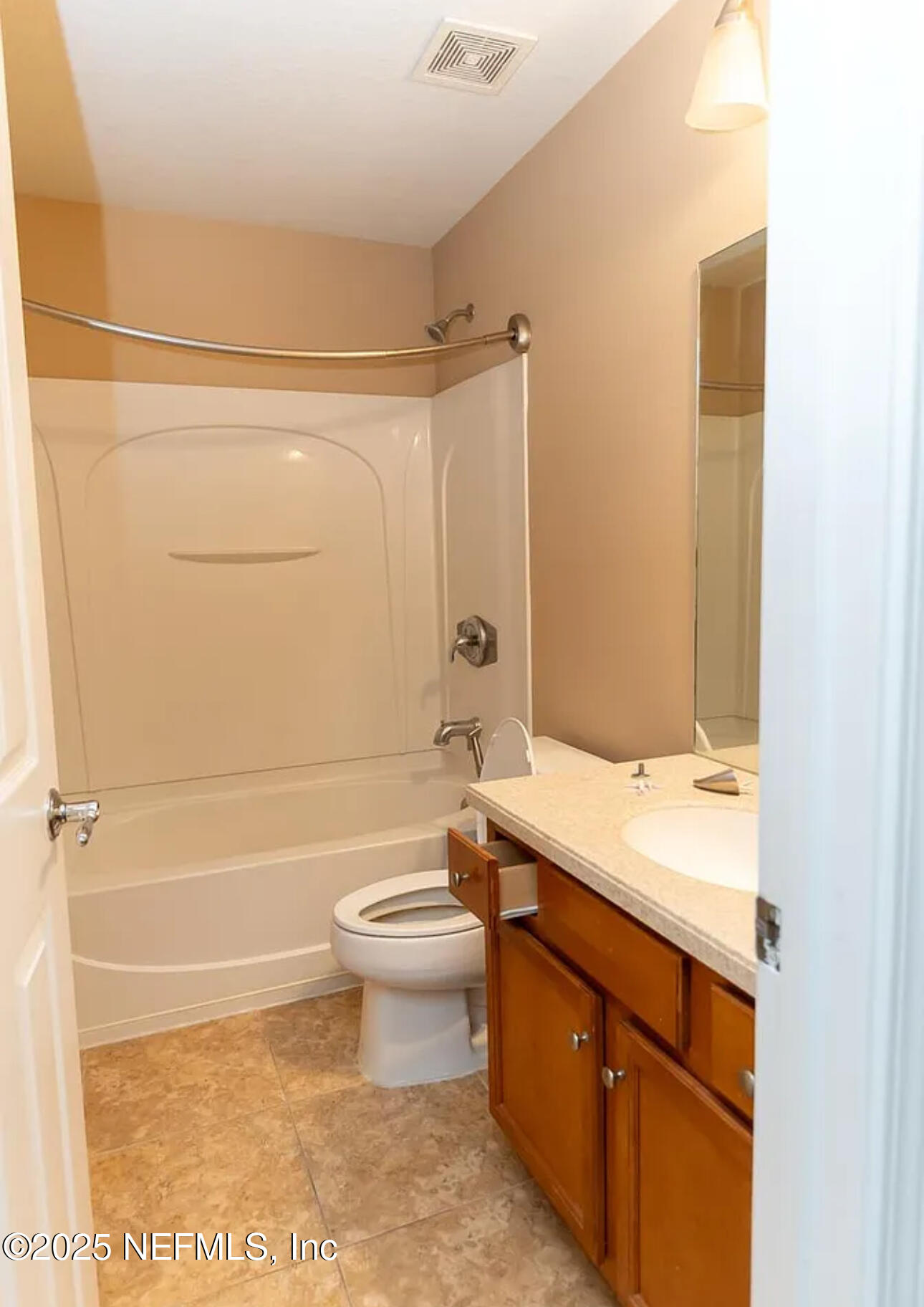 4204 Metron Drive Jacksonville, FL 32216 - Photo 16 of 24 a bathroom with a sink a toilet and shower