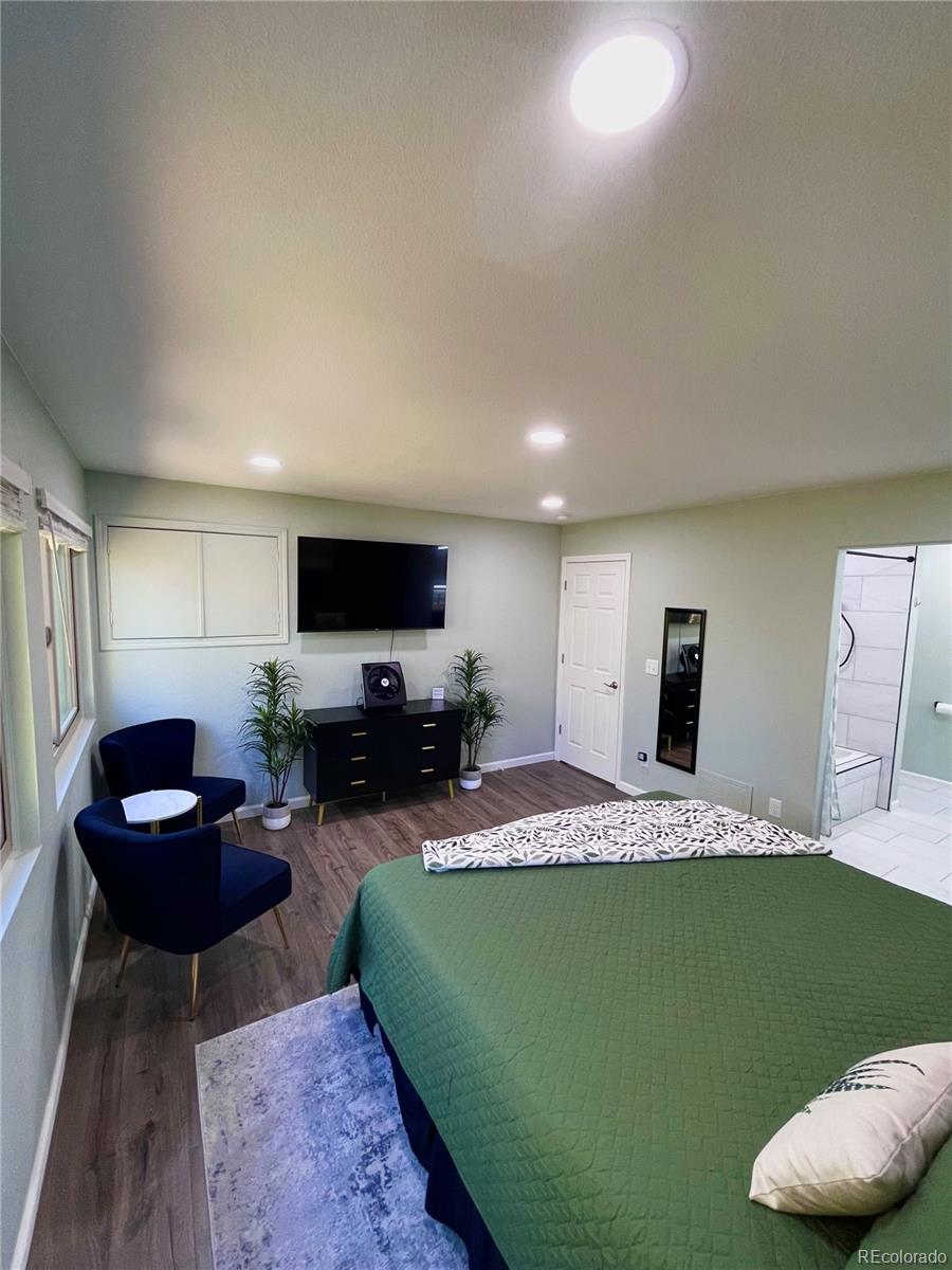 265 Caesar Road Black Hawk, CO 80422 - Photo 25 of 42 a bedroom with furniture and a flat screen tv