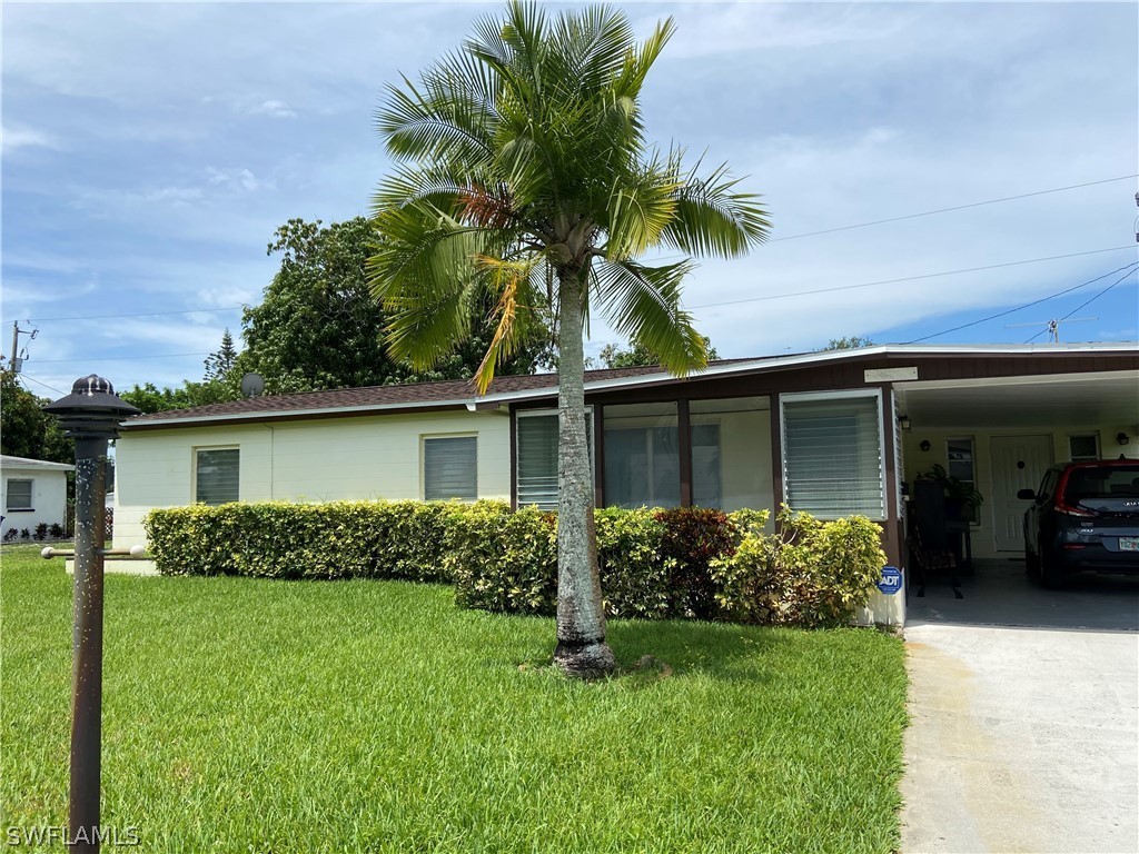 front view of a house with a garden